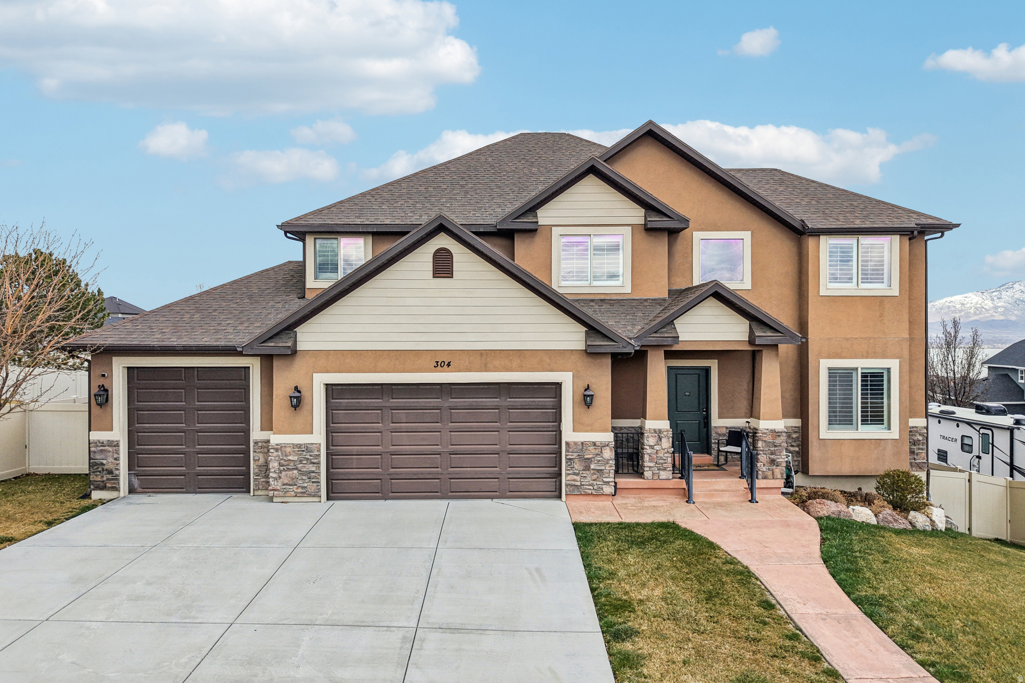 Luxury living awaits in this stunningly updated Saratoga Springs home! 5+ bedrooms and 3.5 baths, this residence features a modern open floor plan, a gourmet kitchen with gas range, and premium plantation shutters throughout. Enjoy views of Utah Lake and the mountains from the covered back deck. The finished daylight/walk-out basement adds incredible versatility, while the 3-car garage provides ample storage. Situated on a prime .21-acre lot. Enjoy world-class community amenities: pool, fitness center, clubhouse, and park. This is the "Luxury Home" you've been searching for! Mortgage savings may be available through the listing agent's in-house lender; ask for details.