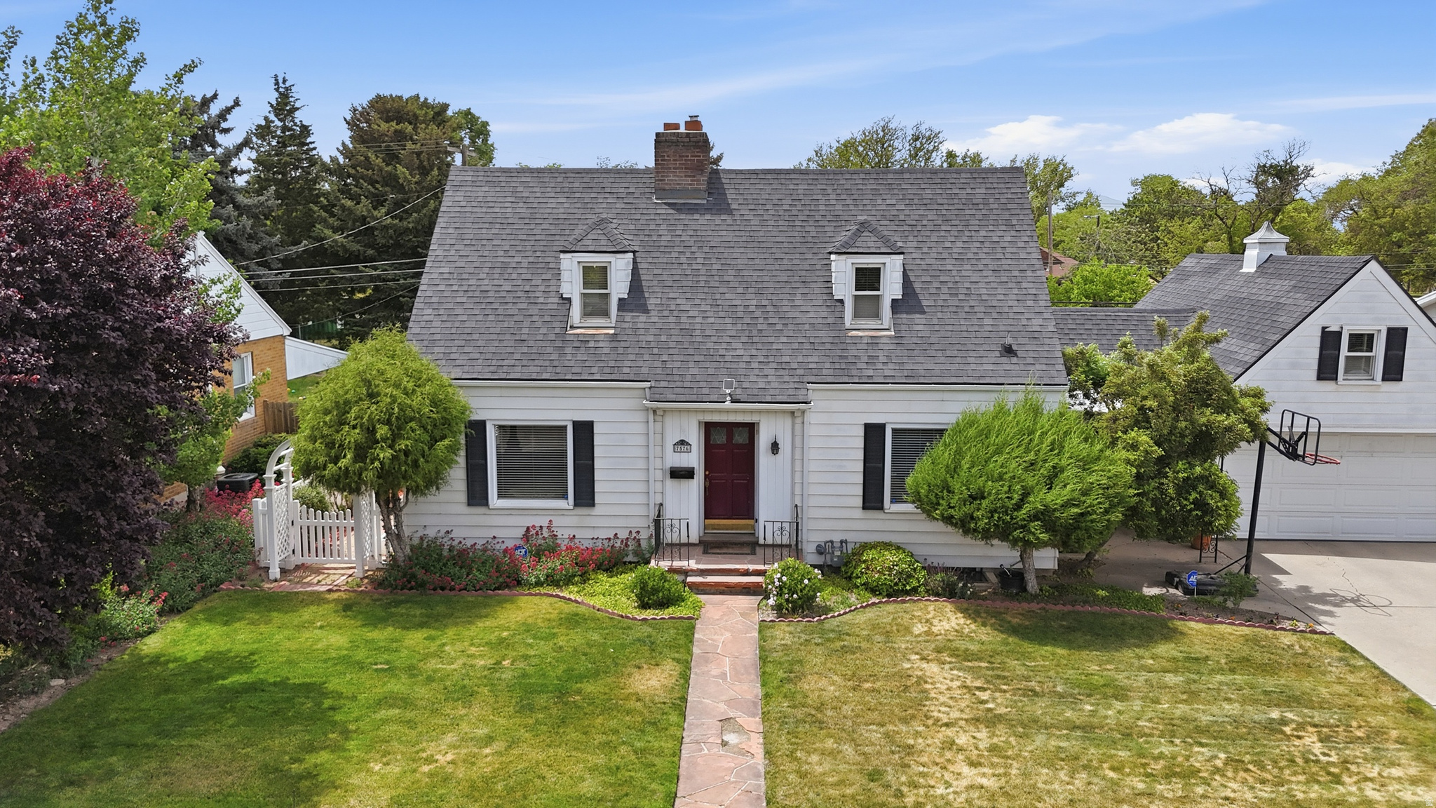 Colonial Charm on Jefferson Street  3 Bed / 2 Bath in the Heart of Midvale.  A timeless colonial-style residence perched on the coveted Jefferson Street, right in the heart of Midvale. Backs up to the tranquil Midvale City Park and sits on a generous .27-acre lot. Lovingly cared for by the same family for decades, now ready for the next owner to add their personal touches. You'll love the character throughout this home that you just don't find in modern builds. The backyard feels like a private sanctuary, boasting a large outbuilding, an outdoor fireplace, and a beautifully tended yard. Square footage figures are provided as a courtesy estimate only and were obtained from public records.  Buyer is advised to obtain an independent measurement.