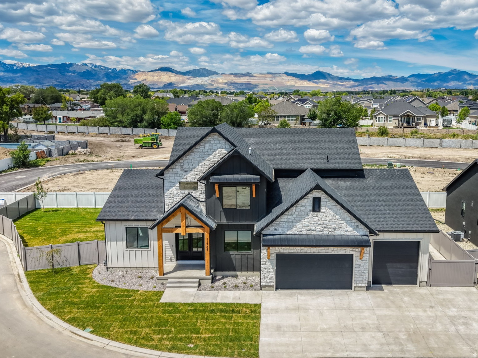 Brand-New Custom-Built Home, Move-in Ready and Fully Finished with Professional Landscaping and Fully Fenced. Grand Entry with Soaring 20-foot Ceilings, Stunning Picture Windows, Custom Trim Work, and Beautiful Fireplace. This incredible Open Floor Plan Features 6 bedrooms, 4 Bathrooms, a Main-Floor Office and Luxurious Main-Floor Primary Suite. Upstairs offers 3 additional bedrooms and a full bath, while the Fully Finished Basement Includes 2 more Bedrooms, a Gym/Workout Room with Infrared Sauna, Theatre Room, and Kitchenette.  The Spa-Inspired Primary Suite Showcases a massive Walk-in Shower with Four Moen Shower Heads, a Freestanding Soaking Tub, and a spacious custom walk-in closet. The Chef's Kitchen Includes Upgraded KitchenAid Appliances, Double Ovens, Quartz Countertops, and a Butler's Pantry. Enjoy seamless Indoor-Outdoor Living with a Covered Patio off the Kitchen, Perfect for Entertaining and Situated on a Large Fully Fenced Corner Lot. This home TRULY has it all.  MUST SEE!!