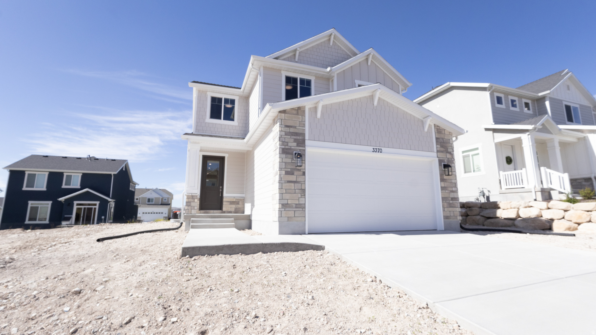 Brand new construction by Revere Homes! This impressive Honeycrisp plan offers 2,633 sq ft with 4 bedrooms and 2.5 baths in a highly convenient Eagle Mountain location just steps from the new Walmart, shopping, dining, and everyday amenities. The open-concept two-story layout features spacious living areas, generously sized bedrooms, and stylish modern finishes throughout. A standout feature is the unfinished basement, already plumbed for an ADU and complete with a separate exterior entrance-providing incredible potential for a future rental unit, multigenerational living space, or private guest suite. Finish it to suit your needs and create instant added value and flexibility. Enjoy the freedom of no HOA and take advantage of a 3% incentive when closing with our preferred  lender. New construction, income potential, and unbeatable convenience all in one home!