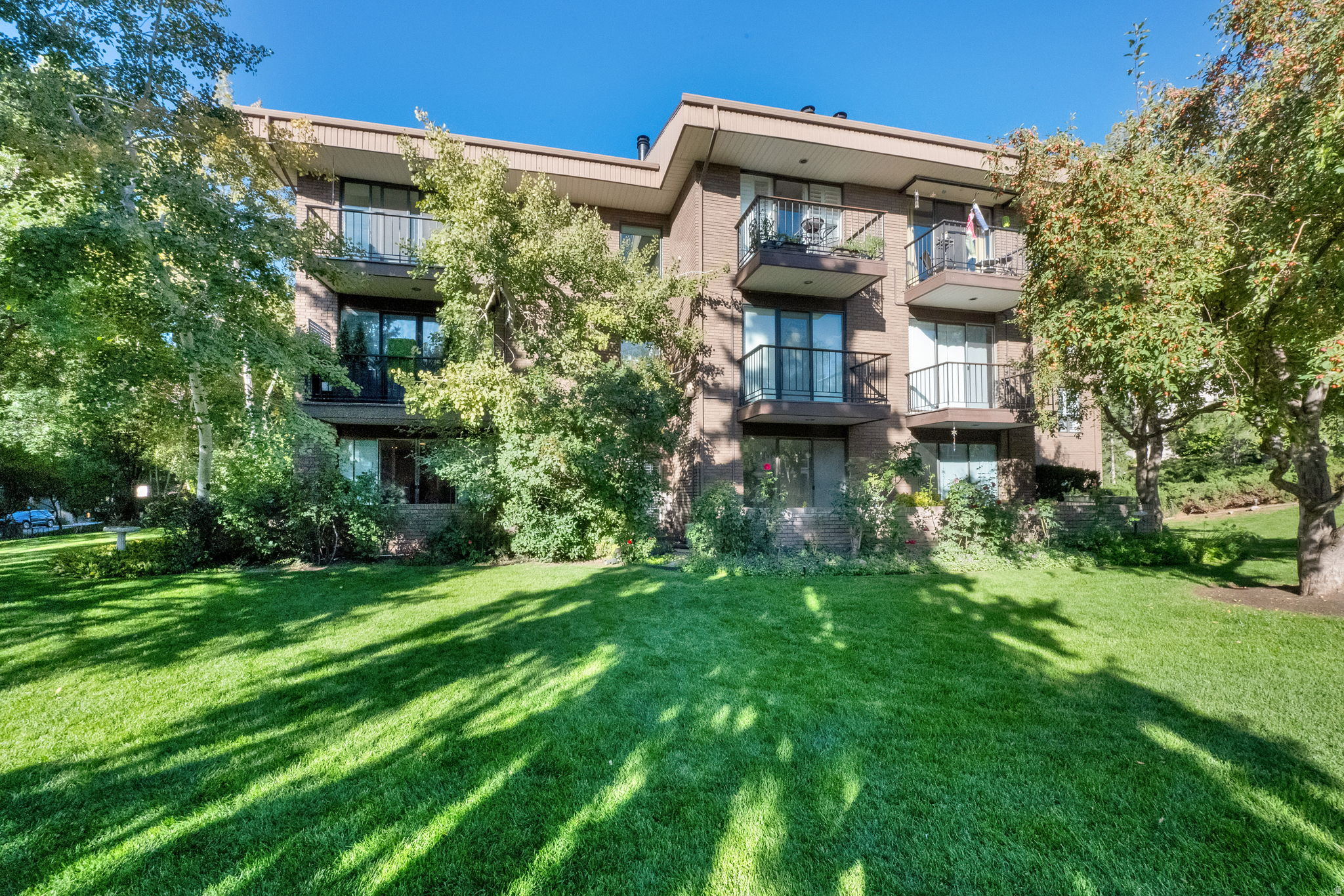 Welcome to Oakwood Gardens Condos - where comfort, convenience, and charm come together! This wonderful 2-bedroom condo located on the top 3rd floor is filled with natural light and perfectly located near Hogle Zoo, Emigration Canyon, hiking and biking trails, Foothill Village Shopping Center, the University of Utah, and downtown. Enjoy the open, inviting floor plan featuring a spacious great room, cozy fireplace, kitchen and vaulted ceilings that create an airy, welcoming atmosphere, making it ideal for both quiet evenings and entertaining. The primary bedroom is a stunning loft suite with abundant light and an incredible walk-in closet offering more storage than you can imagine. Step outside to your private balcony for peaceful moments or casual gatherings. Added conveniences include in-unit washer and dryer, refrigerator, and an assigned parking space in the garage with an additional storage unit. With ALL UTILITIES INCLUDED in the HOA fee, this is easy living at its best! Bring your personal touches and a little TLC to make this the perfect place to call home - a peaceful retreat close to everything you love. Don't miss your opportunity to make this extraordinary space yours! Square Footage provided as a courtesy from County records. Buyer is advised to obtain independent measurements.