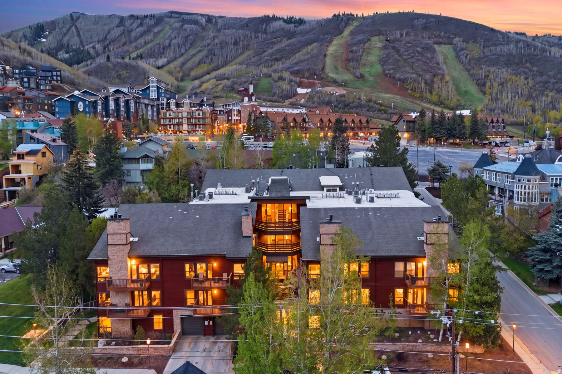 Top-floor corner residence in the heart of Old Town, just steps from the lifts at Park City Mountain Resort - grab your skis and go! This warm and inviting 2-bedroom, 2-bath Silver Cliff condo features vaulted ceilings, abundant natural light, and the privacy of having no one above you. The desirable corner location creates a bright and airy feel throughout, while the two-story layout offers comfortable mountain living with a cozy wood-burning fireplace and inviting gathering spaces for family and friends. Enjoy immediate access to world-class skiing, hiking, biking, dining, shopping, and aprs-ski activities, with historic Main Street just minutes away. Walk to the lifts, restaurants, and resort amenities while avoiding the hassle of resort parking altogether. Offered fully furnished and turnkey, the property also includes underground heated parking, elevator access, and two hot tubs. Exceptional convenience, strong rental potential, and one of Park City's most desirable locations. Sold fully furnished, less attached exclusions list. Property is subject to an existing summer lease. Contact listing agent for lease terms and occupancy dates.