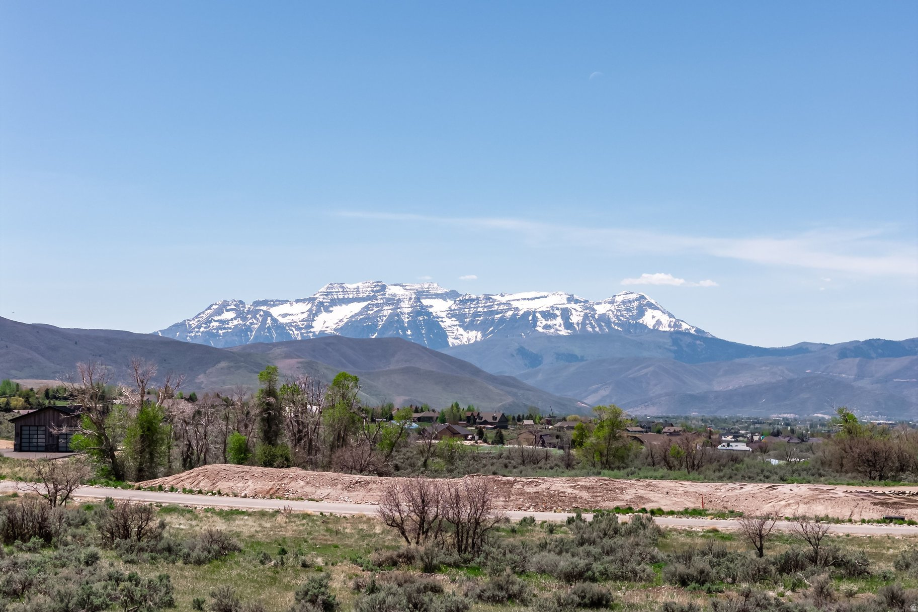 Rare opportunity to own 6.12 acres in the heart of Heber Valley, framed by iconic views of Mount Timpanogos. This premier vacant lot offers the perfect canvas for your custom dream home -- with architectural plans already in hand to fast-track your vision. The lot is exceptionally flat, making it one of the most build-friendly parcels in the valley. Surrounded by Utah's most coveted outdoor lifestyle: world-class ski resorts, championship golf, hiking, fishing, and year-round recreation, all just minutes away. Wasatch Back acreage at this scale, in this location, rarely comes to market. Step outside to hundreds of acres of protected open space within Blue Sage Ranch's conservation easement. Schedule your private showing today. GPS may not navigate correctly to this property. From Main Street in Heber City, head north on 1200 S toward Mill Road, continue approximately 4.8 miles and turn right onto S Skyline View Drive -- property will be on your left. Look for sign.
