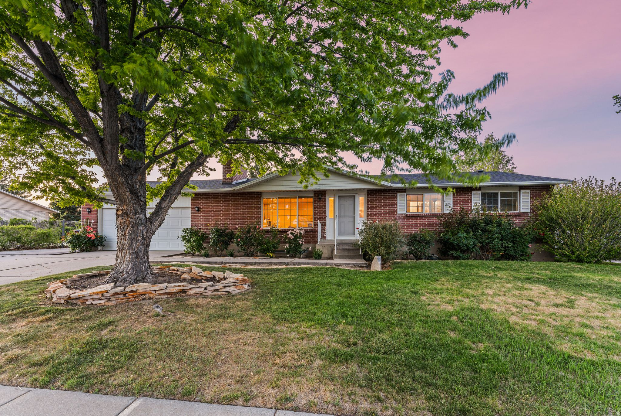 Lovingly owned and well cared for by the same owners for the past 27+ years, this charming Taylorsville home sits on an incredible .27-acre lot - easily one of its best features, with tons of space for entertaining, gardening, play, or future possibilities/expansion. Inside, you'll find a rare primary suite with its own attached bathroom, a recently updated kitchen, brand new furnace, and new carpet in two bedrooms and the living room. Additional highlights include a newer roof, attached two-car garage, and extra parking pad. Located in a well-established neighborhood, this home offers a central location close to shopping, restaurants, parks, and I-15 & I-215 freeway access.
