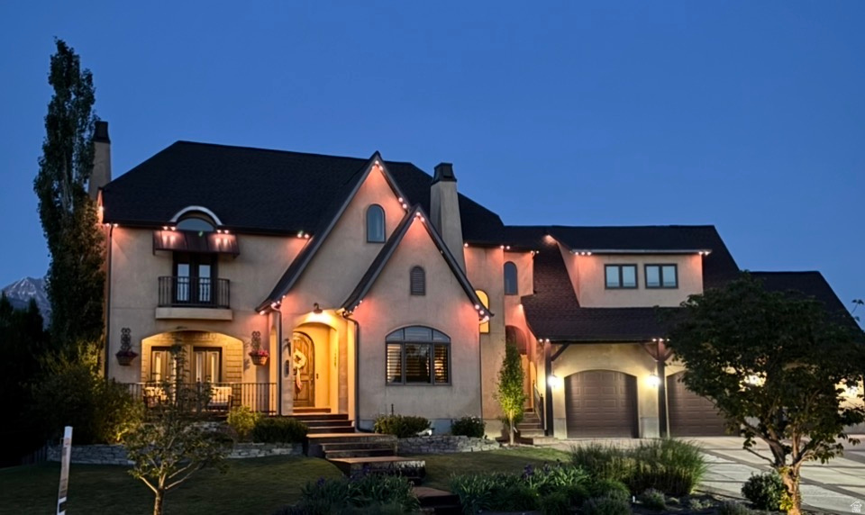 ** SELLER WILLING TO CONTRIBUTE $20,000 BUYER CONCESSIONS** Beautifully updated French Country home is set in a quiet cul-de-sac on a rare 0.35-acre lot, offering a seamless blend of timeless design and modern refinement. Fresh interior paint, new kitchen appliances, and carefully curated lighting enhancements create a sophisticated, cohesive aesthetic throughout.  The second level features three bedrooms and two baths, with a large family room and darling playroom tucked into the eaves. The FULLY FINISHED WALKOUT BASEMENT WITH A SECOND KITCHEN, LAUNDRY, 2 BEDROOMS AND BATH--ideal for a guest suite. Recent capital improvements-including a new roof, newer a/c units, an updated upstairs furnace, and a tankless water heater-underscore the home's exceptional level of care and long-term value. An oversized, extra-height garage offers generous storage and versatility.   The outdoor experience is equally refined, with a spacious deck, exterior fireplace for year-round enjoyment, mature fruit trees, RV parking, and a charming playhouse, creating a setting designed for both enjoyment and effortless entertaining. All while offering effortless access to everyday conveniences, transit, and commuter routes. Call to schedule your personal showing today!   Square footage figures are provided as a courtesy estimate only.