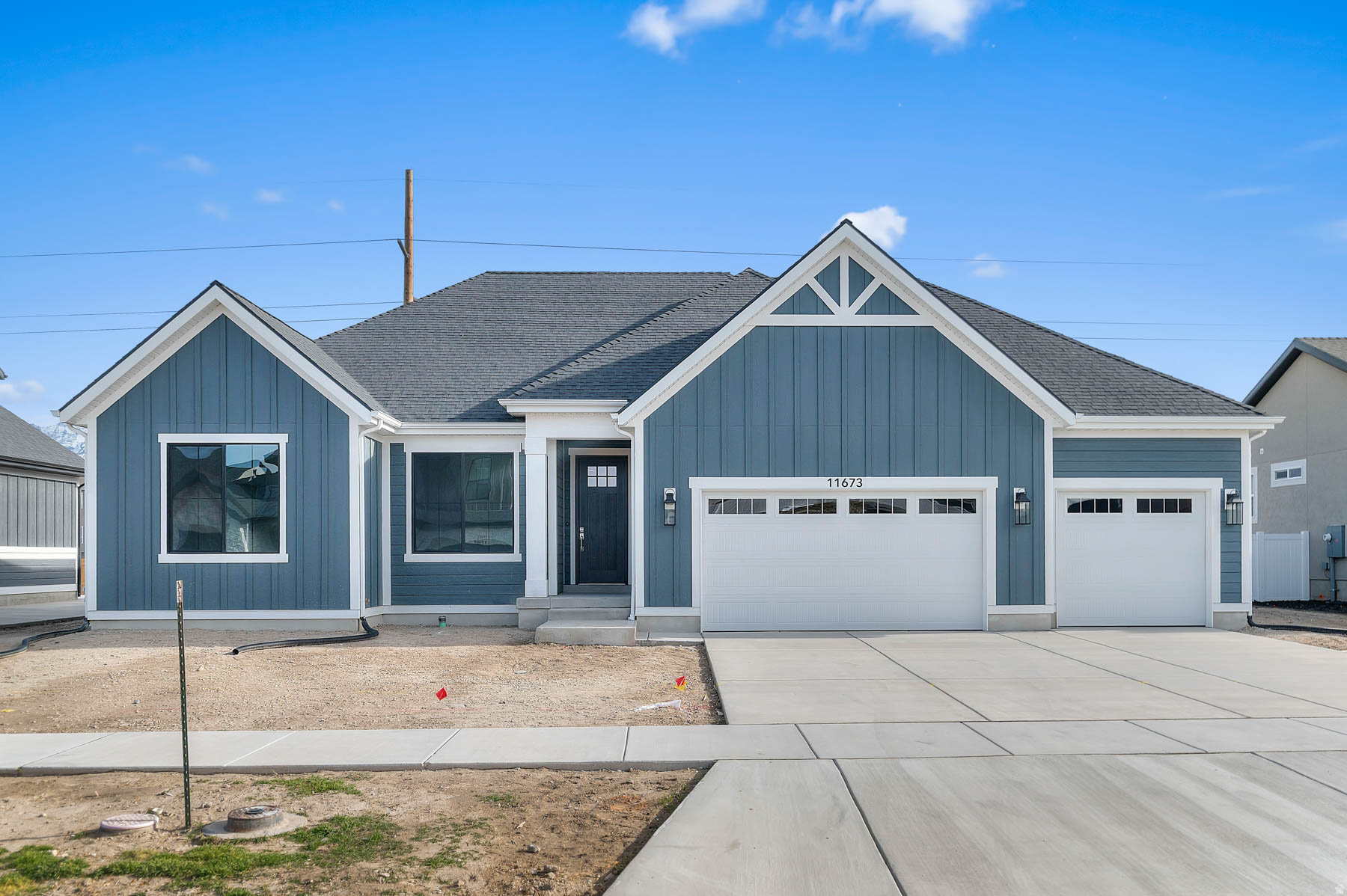 Come see this beautiful brand new Torino Farmhouse, a stunning home combining farmhouse charm with modern luxury. The kitchen features maple cabinets with large crown molding and LED lighting, quartz countertops, stainless steel gas appliances, tile backsplash, and pendant lighting above the island, creating an inviting space for entertaining. Enjoy spacious living with 9- foot basement foundation walls, a walk-up basement door, and a 3-car garage with an exit door. The design includes box windows in the kitchen nook and owner's bedroom, textured walls, 2-tone paint, and Entrada base and casing for an elegant finish. Additional highlights include can lighting, a Christmas light package, gas line to the dryer and BBQ, radon system, and a gas log fireplace in the family room for cozy evenings. The office with French doors adds functionality in place of a fourth bedroom, while the owner's bathroom showcases tile surrounds and chrome hardware, completing this beautifully detailed and thoughtfully designed farmhouse.