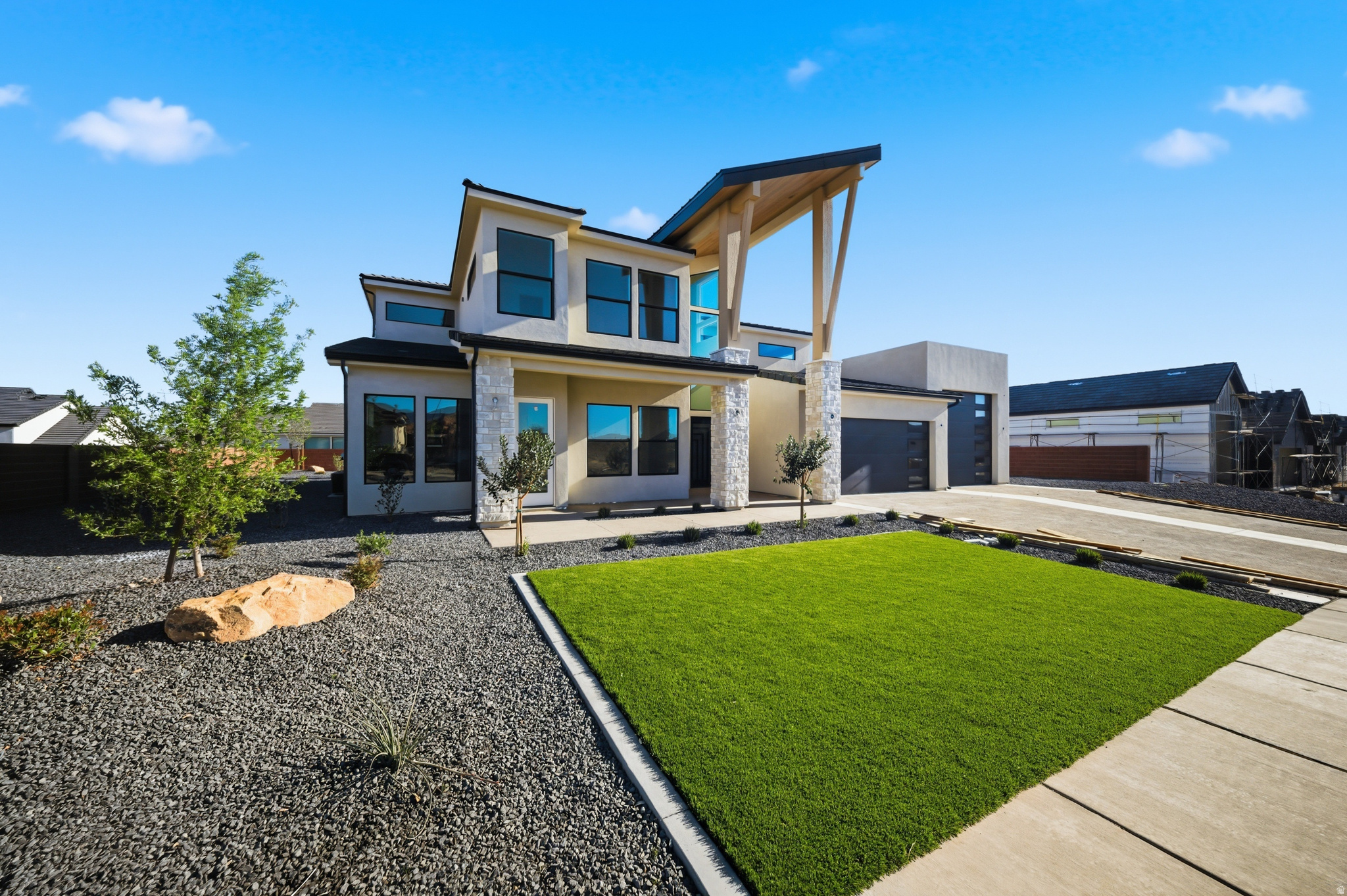 Striking new construction with modern design and flexible living spaces. This 5 bed, 4.5 bath home features an attached casita ideal for guests or potential rental income. A 2-car garage plus oversized RV/boat garage and additional parking offer exceptional functionality. The thoughtfully designed layout includes an extra upper-level family room, a dedicated theatre, and a spacious primary suite with a second laundry area. Enjoy seamless indoor-outdoor living with a covered deck and patio, perfect for entertaining or relaxing. A rare combination of style, space, and versatility in a beautifully designed spec home! Outdoor living is equally impressive with a covered deck and patio, perfect for relaxing or hosting gatherings while enjoying the surrounding views. Clean architectural lines, modern finishes, and a well-planned layout make this home as functional as it is striking. A rare combination of design, space, and versatility this home is built to support the way you live today.