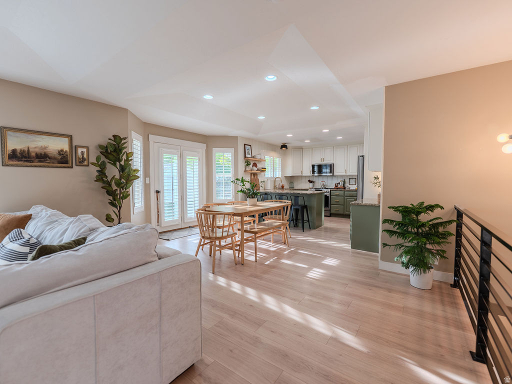 Welcome to this beautifully renovated rambler in a premier Roy location, perfectly positioned directly across from pickleball courts, basketball courts, and a playground. Enjoy morning sun and afternoon shade with easy access to outdoor recreation and community amenities right in your backyard. Inside, the home feels bright and airy thanks to an open floor plan, generous windows, and stylish plantation shutters. The living spaces flow together for today's living, perfect for entertaining or everyday life. The kitchen is updated with new appliances, offering modern convenience and a clean, timeless look. You'll appreciate practical upgrades throughout, including a new water heater and a new water softener for peace of mind and improved efficiency.   Square footage figures are provided as a courtesy estimate only and were obtained from an appraisal.  Buyer is advised to obtain an independent measurement.