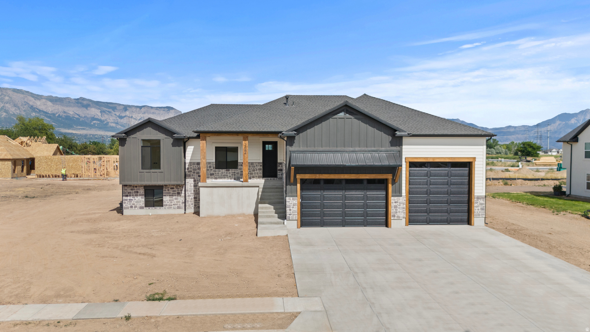 ***Open house Saturday 7/18 2:00-4:00. Dessert provided by Maison Miette!!***  (Professional photos coming Friday)   Welcome to this stunning new custom built home in the heart of Plain City, where luxury, functionality, and thoughtful design come together on nearly half an acre with breathtaking mountain views. This spacious home features an open concept floor plan with vaulted ceilings, abundant natural light through the large windows, and exceptional custom craftsmanship throughout. Every detail has been carefully considered, from the beautiful finish work and designer selected tile in the bathrooms, to the high end finishes that create a warm, elegant feel. One of the home's standout features is the basement ADU (mother-in-law apartment) with 9-foot ceilings! This offers incredible flexibility for multi-generational living, long-term rental income, or a private guest retreat. The basement also has a large, unfinished area that could be completed to add another bedroom and bathroom, office, gym, theater, or leave it as a large storage space.  Outdoor living is just as impressive with a large covered deck overlooking the backyard, which flows seamlessly to a concrete patio, perfect for entertaining or simply enjoying the stunning mountain backdrop. Car enthusiasts, hobbyists, and those needing extra storage will love the massive 50' x 16' 3rd bay garage, complete with an oversized 12' x 12' garage door that's ideal for larger vehicles, RV storage, boats, or workshop space. Located in the heart of Plain City, this exceptional property offers the perfect balance of peaceful country living and everyday convenience. You'll enjoy easy access to shopping, dining, golf, and I-15 while coming home to expansive views and room to breathe. Opportunities to own a beautifully crafted new construction home in Plain City on almost half an acre with premium finishes, an ADU and close access to all the amenities are becoming more and more rare. Don't miss the opportunity to make this beautiful house your new home.   Square footage figures are provided as a courtesy estimate only and were obtained from construction plans .  Buyer is advised to obtain an independent measurement.