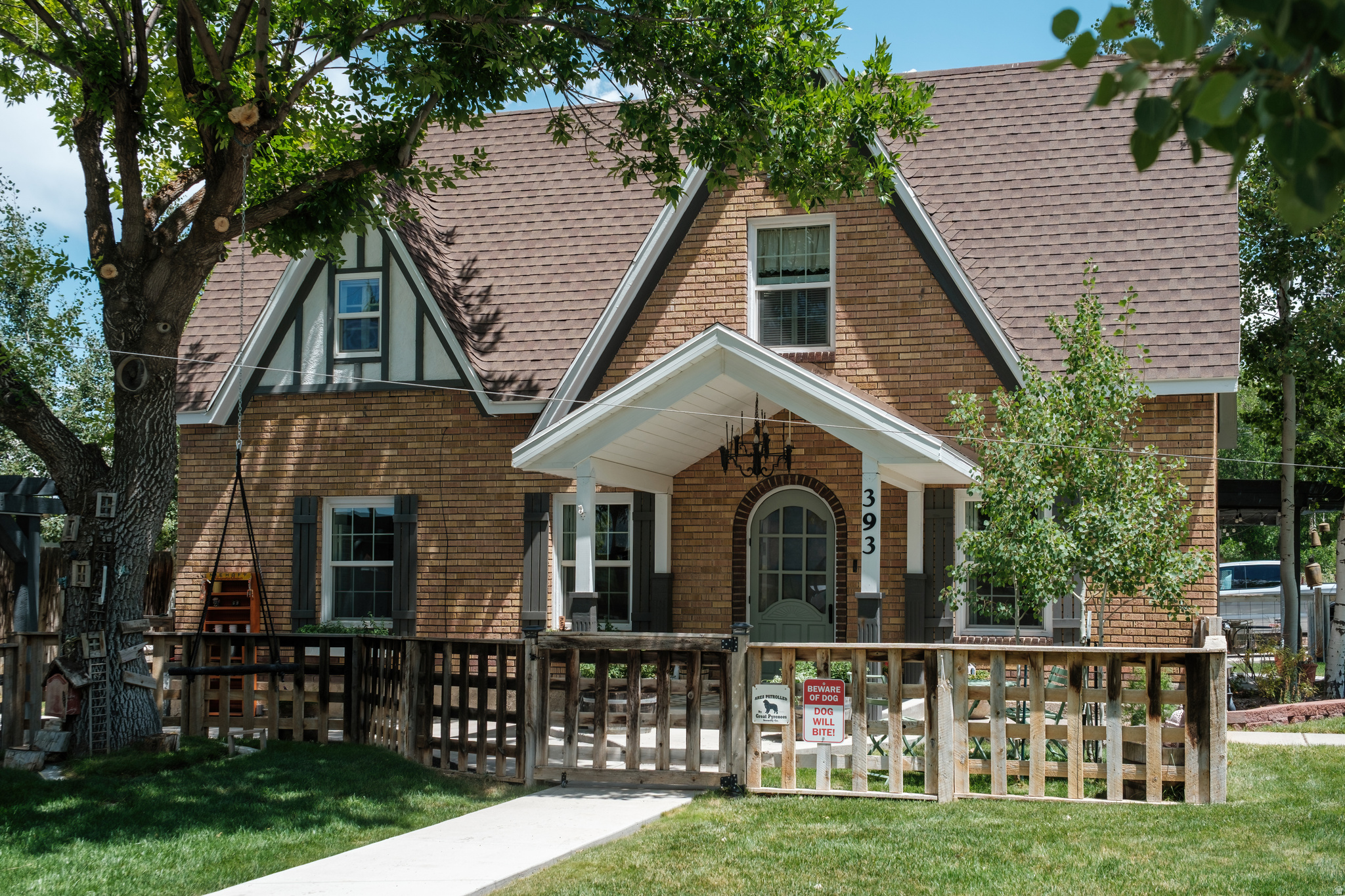 No Showings until Open House on Sat, July 18, 1-4 pm! Welcome to this beautifully restored and thoughtfully expanded 1916 Tudor home where timeless storybook charm meets modern cottage functionality. Over the years, the owners have carefully transformed nearly every corner of the property while preserving the architectural details that make historic homes so special.  Inside, you'll find original brick, a classic clawfoot tub, preserved historic windows, custom finishes, and inviting living spaces filled with warmth and personality. The remodeled kitchen features custom old-time cabinetry, double ovens, a pot filler, farmer's sink and abundant workspace that includes an added-on butler's pantry with a matching farmer's sink.  Multiple bathroom updates, a spacious laundry room addition, central air conditioning, and a finished home office provide the conveniences of modern living.  Storage is exceptional for a home of this vintage, with oversized garage space, walk-in attic storage, dedicated storage rooms, and flexible spaces that can serve as an art studio, playroom, hobby room, or additional office.  Outside, the property is equally impressive. Mature aspens, custom pergolas, a peaceful water feature, private courtyard, garden area with irrigation, RV parking, expanded circular driveway, storage shed with electricity, and a dog shower with hot and cold water, and extensive concrete improvements create a backyard designed for everyday living and memorable gatherings. The outdoor spaces have even hosted family celebrations and a wedding reception.  If you've been searching for a home with authentic character, thoughtful updates, incredible functionality, and a story all its own, this one is truly a rare opportunity. Buyer and buyer's agent to verify all information, including square footage.