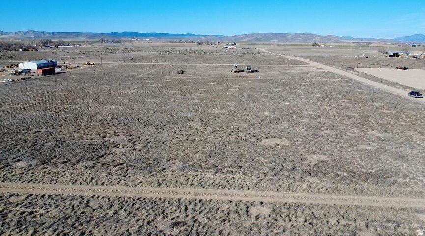 0.50 acre, flat and ready to build, lot in Beryl Junction with a well to be installed prior to closing and a well share agreement with the parcel to the north. Includes 0.5 Acre Foot of Water Right #71-6066 (Priority Date 12/27/1956). Dixie Power is located just 200 feet away on 300 East. Excellent Highway 18 access with easy year-round access. Ideal for a primary residence, second home, cabin, or weekend retreat. Bring your RVs, trailers, and toys. Great opportunity to build now or buy and hold as water-backed land continues to grow in value. Located 15 minutes to Enterprise for groceries, gas, schools, dining, and medical, and about 50 minutes to St. George or Cedar City. Close to reservoirs for boating and fishing. Explore all of the nearby mountain trails with your off road vehicles.