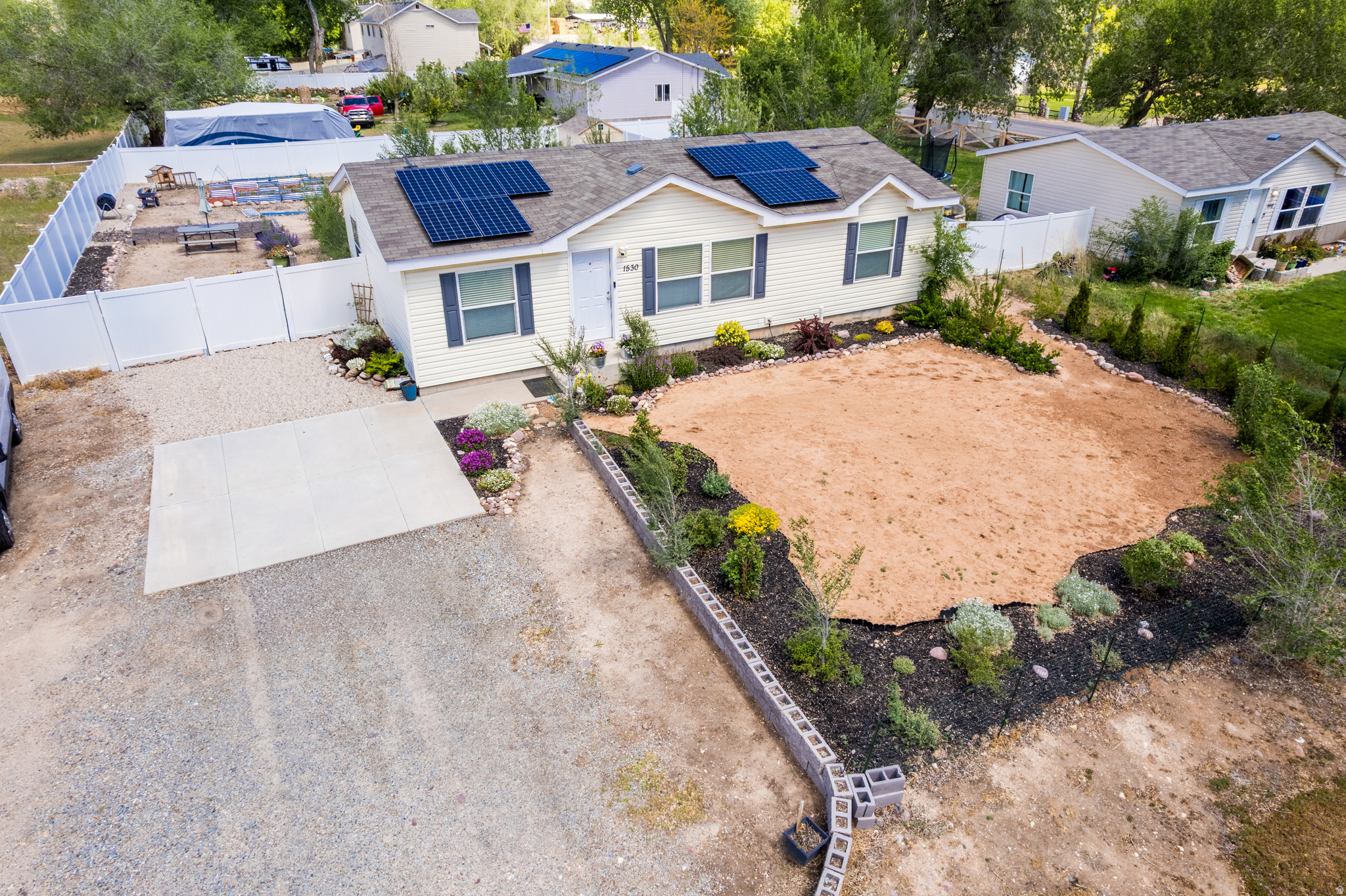 Charming 3 Bedroom/2 Bathroom on 0.42 acres w/ beautifully landscaped granny-style gardens featuring flower beds, shrubs, trees & raised garden boxes. Blackberry & raspberry canes established. Garden already planted and fall harvest ready. Vinyl fenced backyard. Rooftop solar averages just $12/mo power bill 9 months of the year (winter months vary). A true lifestyle property - gardens, privacy & savings all in one. Don't miss!  Square footage figures are provided as a courtesy estimate only and were obtained from county records .  Buyer and buyer's agent are advised to obtain an independent measurement.