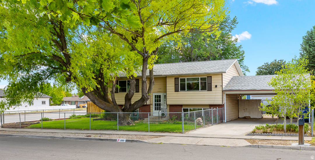***OPEN HOUSE: Saturday, Jun 27th from 11 A.M. - 1 P.M.***WELCOME HOME! This beautiful 4-bedroom, 2-bathroom retreat is filled with modern updates. The open floor plan offers the privacy and comfort you've been looking for with its fully fenced front & backyard! Updated kitchen features new LVP flooring, granite countertops, and a fresh, modern feel. New dishwasher & disposal. The basement has been refreshed with new paint and carpet, along with new vinyl flooring in the basement bathroom. Central air throughout.  Major updates provide peace of mind, including an HVAC system that is only three years old and a brand-new roof installed this year! The walkout basement offers convenient access with a mother-in-law apartment potential. Cold storage for all your canned goods in the basement. Large, spacious quarter-acre lot with full sprinkling system. Backyard provides endless possibilities for a garden, playground, pool, or even a pickleball court! Relax and take in the view from the covered backyard deck. The 2-car garage and double carport provides plenty of parking and storage space. Shed included to store your lawn mower & tools. There's even enough space for a small boat or trailer. This wonderful home on a quiet, tree-lined street COULD BE YOURS TODAY!