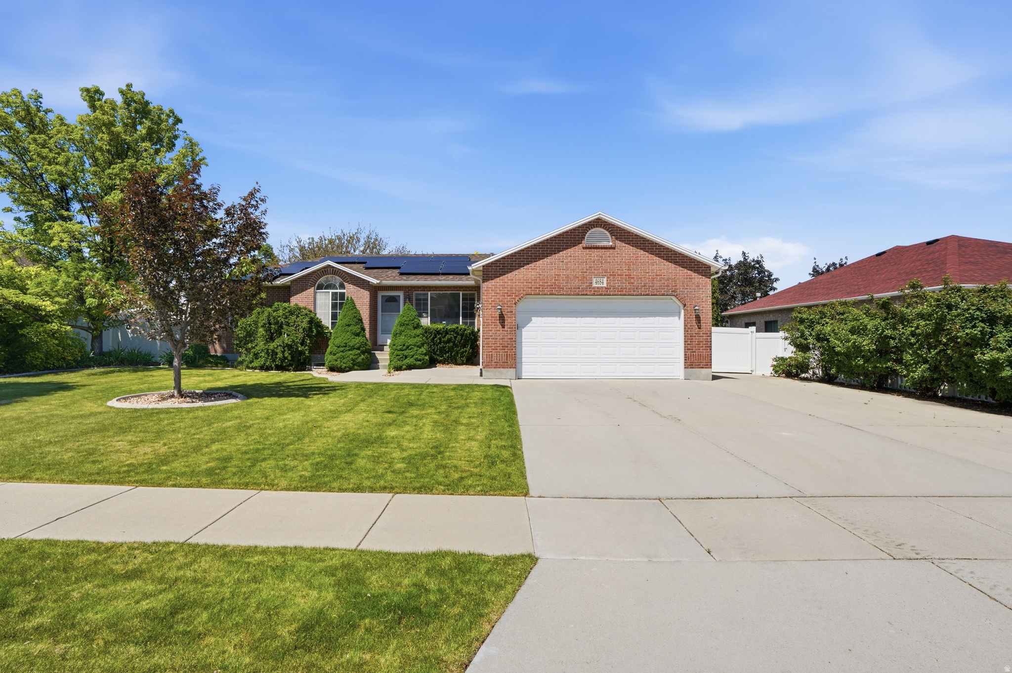 Offers will be reviewed on Sunday, 5/17/26. Beautiful South Jordan home in walking distance to Glenmoor Golf Club, several parks and Tetons Golf Disc Park.  Basement apartment with a separate entrance gives great flexility with living arrangements. Large covered patio makes a great space for entertaining for many months of the year. With fresh new paint, 3 year old roof and newer HVAC, this home is immaculately maintained. This home also has a paid off solar system and RV parking pad for your toys. SF per county, buyer to verify all.