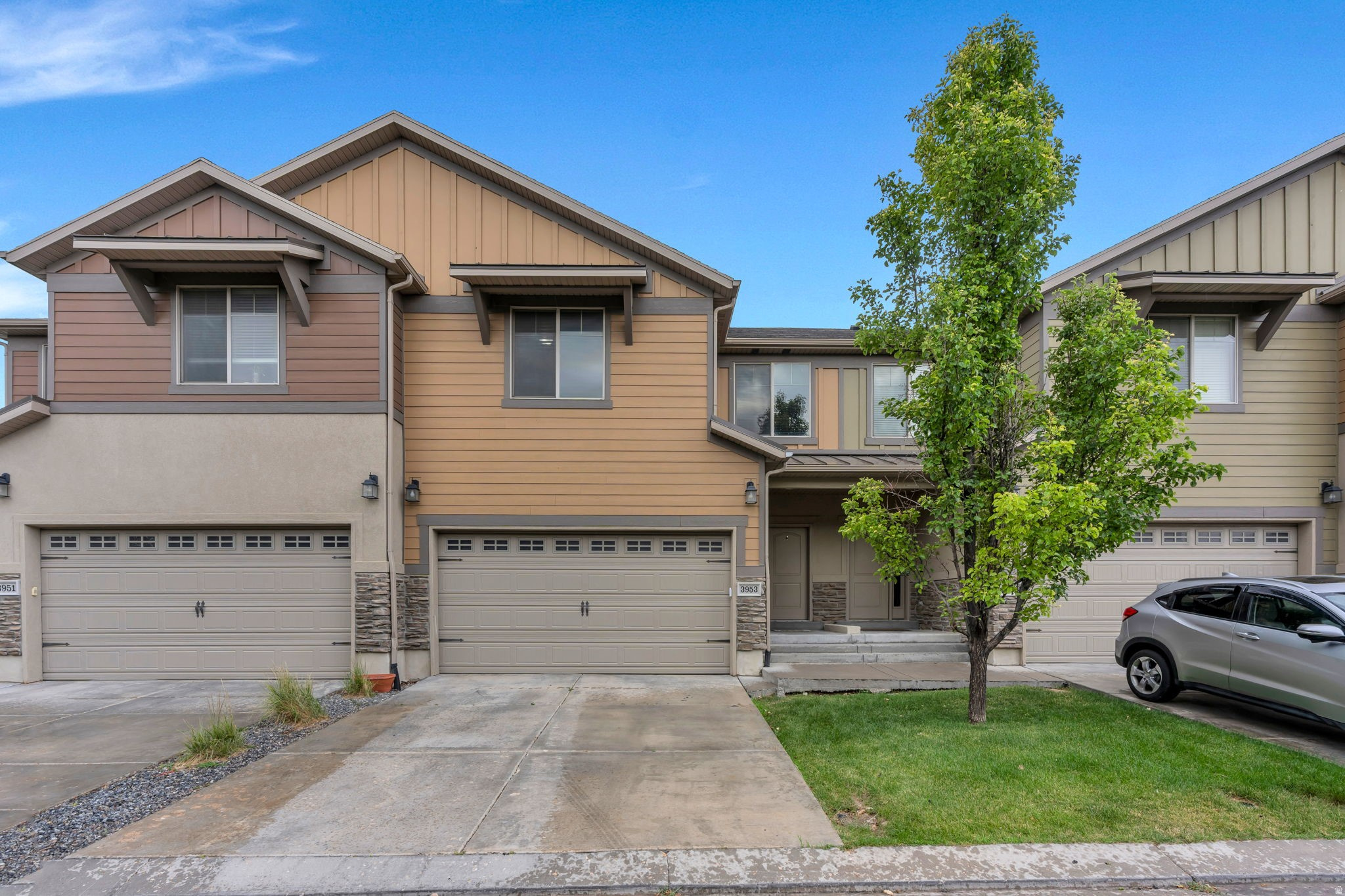 Welcome to this beautifully maintained South Jordan townhome, offering a spacious layout, stylish finishes, and fantastic community amenities. With a 2-car garage and a thoughtfully designed floor plan, this home is the perfect blend of comfort and convenience.  The bright and open great room creates an inviting space for both everyday living and entertaining. Rich cabinetry, faux wood flooring throughout the main living areas, and an open-concept design provide warmth and timeless appeal. Step outside to the covered deck, an ideal spot to enjoy your morning coffee or unwind after a long day.  The spacious primary suite offers a relaxing retreat with a luxurious ensuite bathroom featuring a separate soaking tub and shower, dual vanity with granite countertops, and plenty of space to start and end your day in comfort. A conveniently located upstairs laundry room adds ease to daily living.  Downstairs, the finished basement expands the home's living space with two additional bedrooms, offering flexibility for guests, a home office, or growing households.  Residents enjoy access to outstanding community amenities, including a swimming pool, clubhouse, park, and basketball courts, making it easy to enjoy an active and connected lifestyle.  Conveniently located near shopping, dining, schools, and recreation, this South Jordan townhome offers low-maintenance living with all the space and amenities you've been looking for. Don't miss your opportunity to call this beautiful home your own!