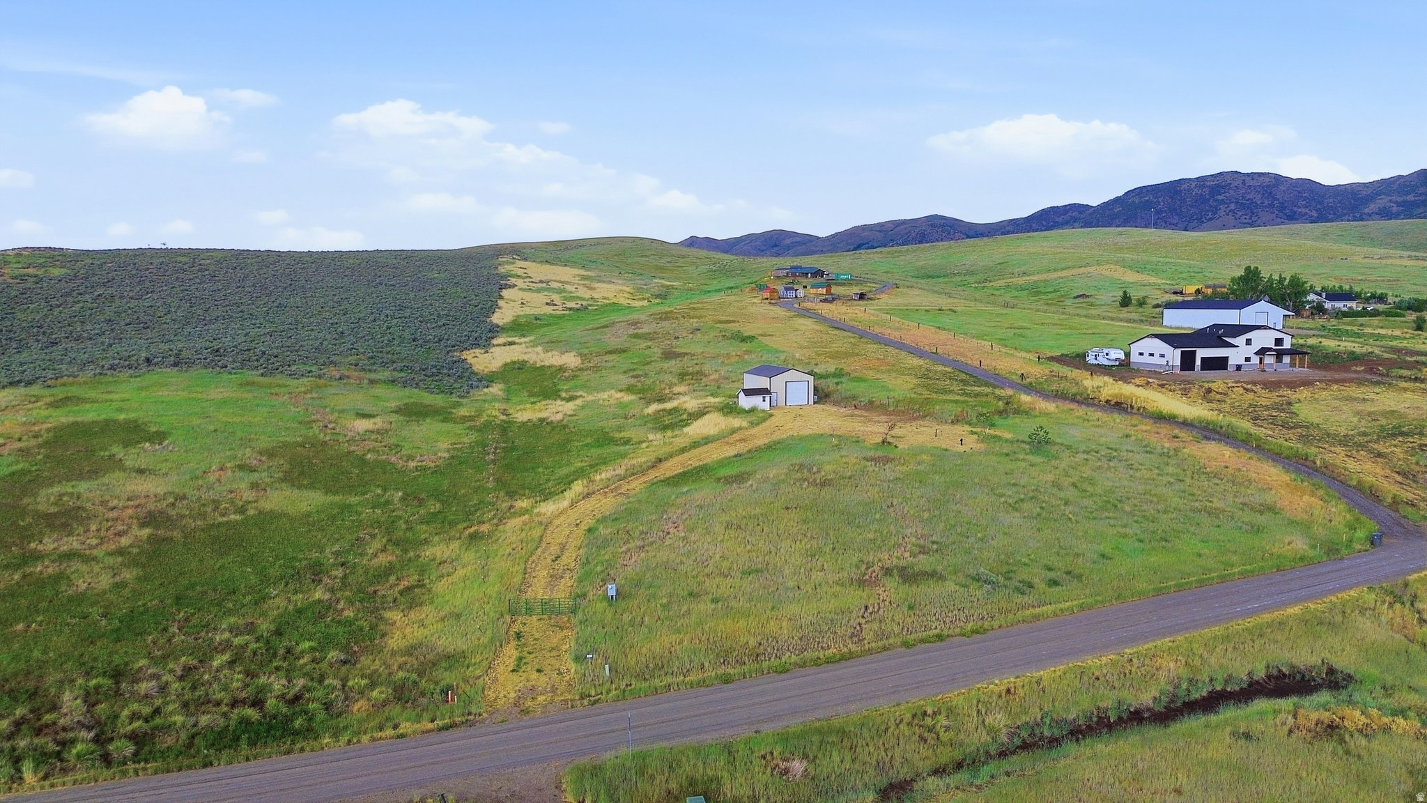 Build your dream home on this beautiful 8.08-acre property in the desirable New Canyon area of Malad, Idaho! This property is truly ready for construction with many of the major improvements already completed. Power is already installed with its own meter, and the culinary well has been drilled and is producing approximately 30 gallons per minute, giving you an excellent head start on your building plans. Just bring your house plans and start digging! The property also includes a 24' x 36' (approximately 864 sq. ft.) pole barn with power and an oversized door large enough to accommodate an RV, plus an additional 12' x 9.5' (approximately 114 sq. ft.) storage building for extra space. As an added bonus, everything currently located inside both outbuildings is included with the sale, making this an exceptional value. Whether you're looking for room to build, enjoy country living, or create your own private retreat, this property offers endless possibilities with improvements already in place. Don't miss this incredible opportunity-properties this ready to build don't come along often! Buyer to verify all information.