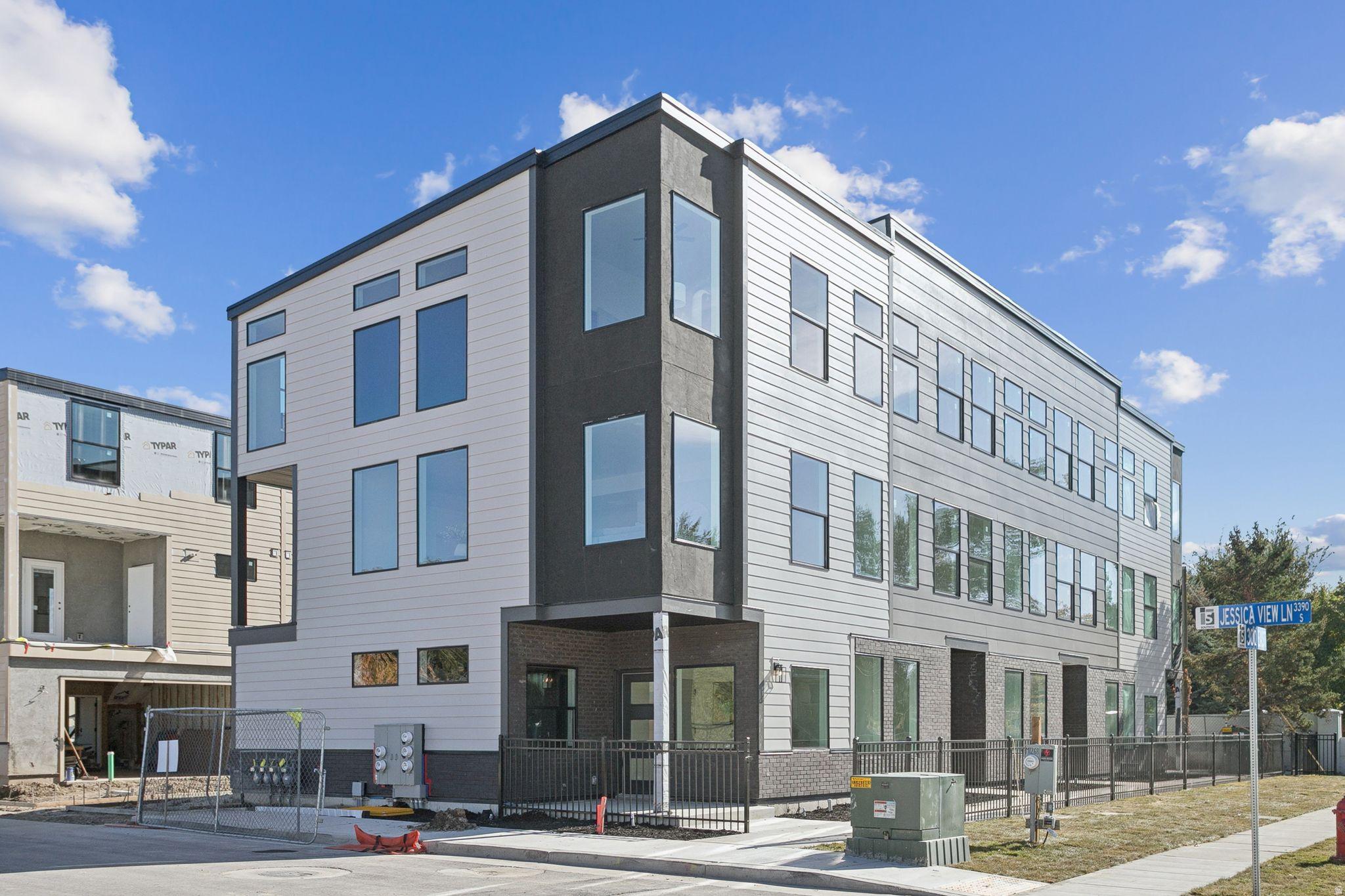 Model now open!! Builder is offering $15,000 in buyer incentives to pay for your closing costs or lower your interest rate using preferred lender!! 300 Lofts Townhomes, a pinnacle of modern living in South Lake Utah brought to you by Next Level Homes! Step into the epitome of contemporary style with this stunning PUD-style townhome, offering not just a residence but a savvy investment opportunity. Designed with a sleek, modern vibe, this home features an expansive open great room, three bedrooms including a luxurious primary ensuite, three bathrooms, a chic glass balcony, and a generous two-car garage. Embrace a lifestyle of convenience and community with amenities like a pickleball court, a dog park, and two vibrant social firepit/BBQ areas. Situated just moments from the bustling 3300 South commerce corridor, you'll have easy access to a plethora of dining options, boutique shops, a cinema, cozy cafes, and major commuting routes including Interstate 15 and Trax/bus lines. Whether you're headed to downtown Salt Lake, Salt Lake Community College, Westminster University, University of Utah, the breathtaking Wasatch Canyons, or catching a flight at Salt Lake International Airport, you're just a quick 10-15 minute commute away from it all. Don't miss out on the chance to make 300 Lofts your new address-where contemporary design meets unbeatable convenience in South Lake Utah! Make your reservation now!