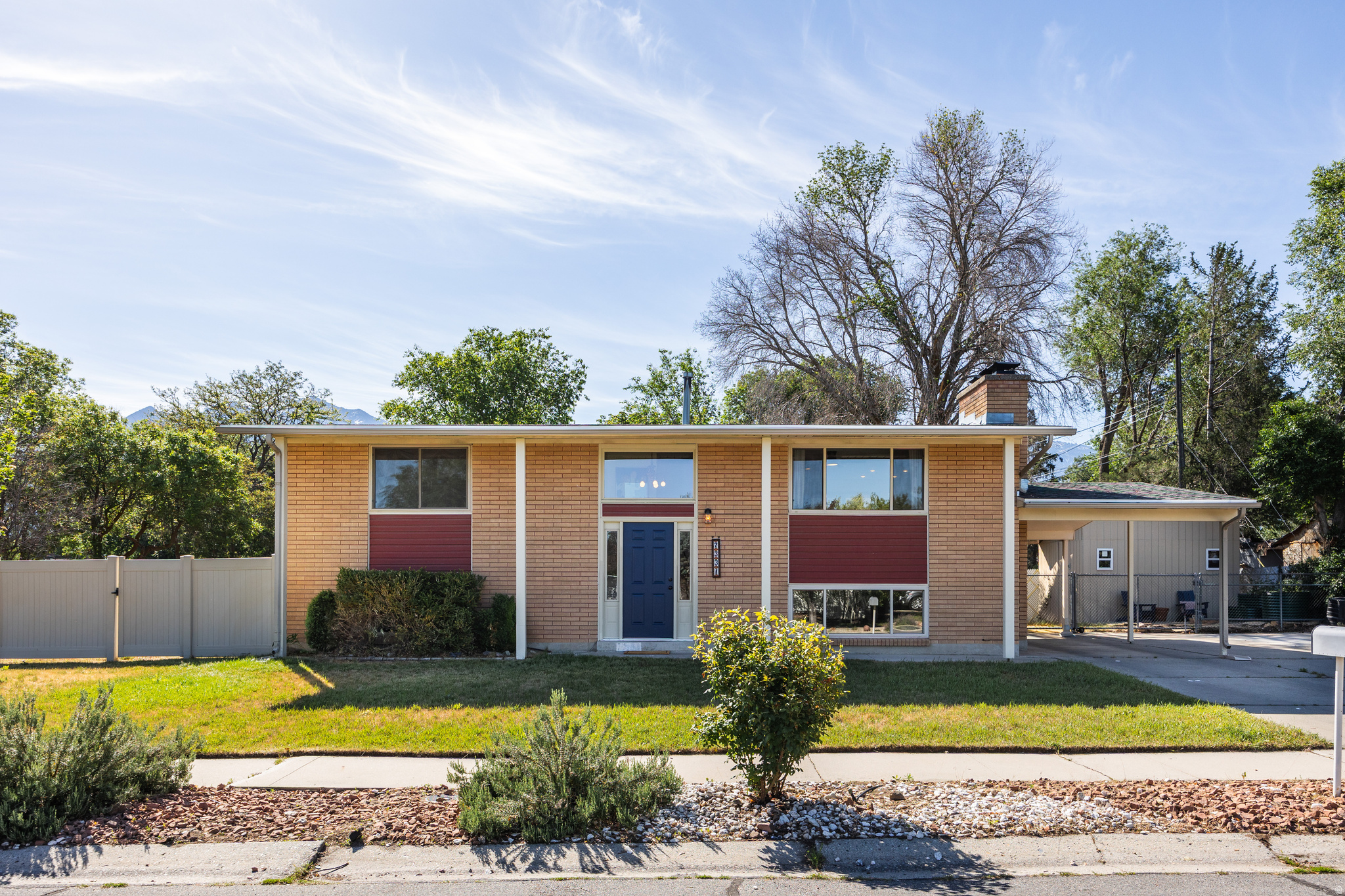 Tucked into a lovely, quiet street in the heart of Cottonwood Heights, this classic, solid brick split-level offers a great location, open floor plan, and large yard to enjoy year-round. Inside, you'll find an updated kitchen with a large island, perfect for gathering or prepping your favorite meal. The flow here is superb; friends and family can stay connected in the adjacent great room, which is filled with natural light, while also enjoying easy access to the covered deck and backyard area. Summer barbecues will come easily here, and there's a cute firepit area for evenings that call for friends and cocktails, but you'll find tiered beds for gardening, a large shed for organization, and plenty of room to play croquet or cornhole. With four spacious bedrooms (two up, two down), a pair of bathrooms, and two family rooms, there's room enough here for everyone to relax (we think the lower family room woodstove lends itself perfectly to game nights, movies, or a cozy library). In terms of updates, the home has newer windows, HVAC, and roof, along with fully paid solar panels that ensure efficiency and comfort. If the possibility of some rental income or multigenerational living is on your list, there's a separate entrance to the basement, allowing for flexibility no matter your needs. Now, let's talk location: outdoor enthusiasts will love the easy access to Big and Little Cottonwood Canyons, but there's also endless shopping and dining, and easy freeway access for those in the market for a clean commute. Don't miss the chance to put down roots in a desirable area on the east side. Square footage figures are provided as a courtesy estimate only. Buyer is advised to obtain an independent measurement.
