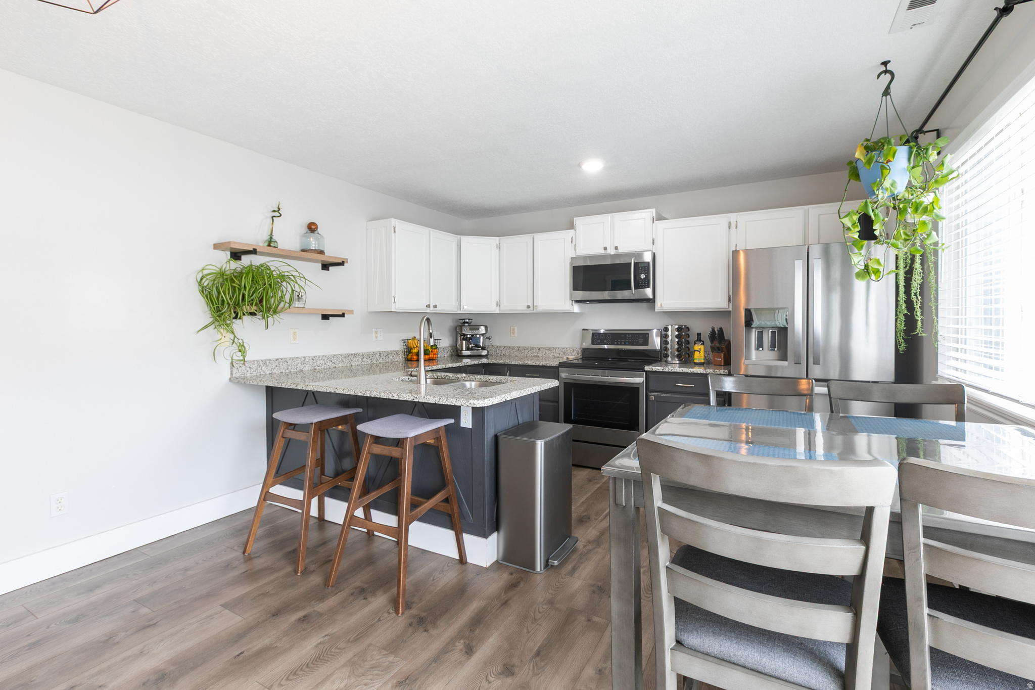 Best-positioned Harrisville townhome at an affordable price- 3 bedrooms, 2 baths, 1,212 sq ft, a private enclosed patio perfect for privacy and entertaining! Freshly repainted kitchen cabinets in this spacious kitchen with ample counter space, Spacious bedrooms, updated baths, and tons of natural light!  Enjoy low maintenance living with HOA amenities and convenient commute on I-15, as well as near shopping, dining, and the aquatic center. The owners have put a lot of love into the home and it's now ready for a new homeowner.  Check out the virtual tour!