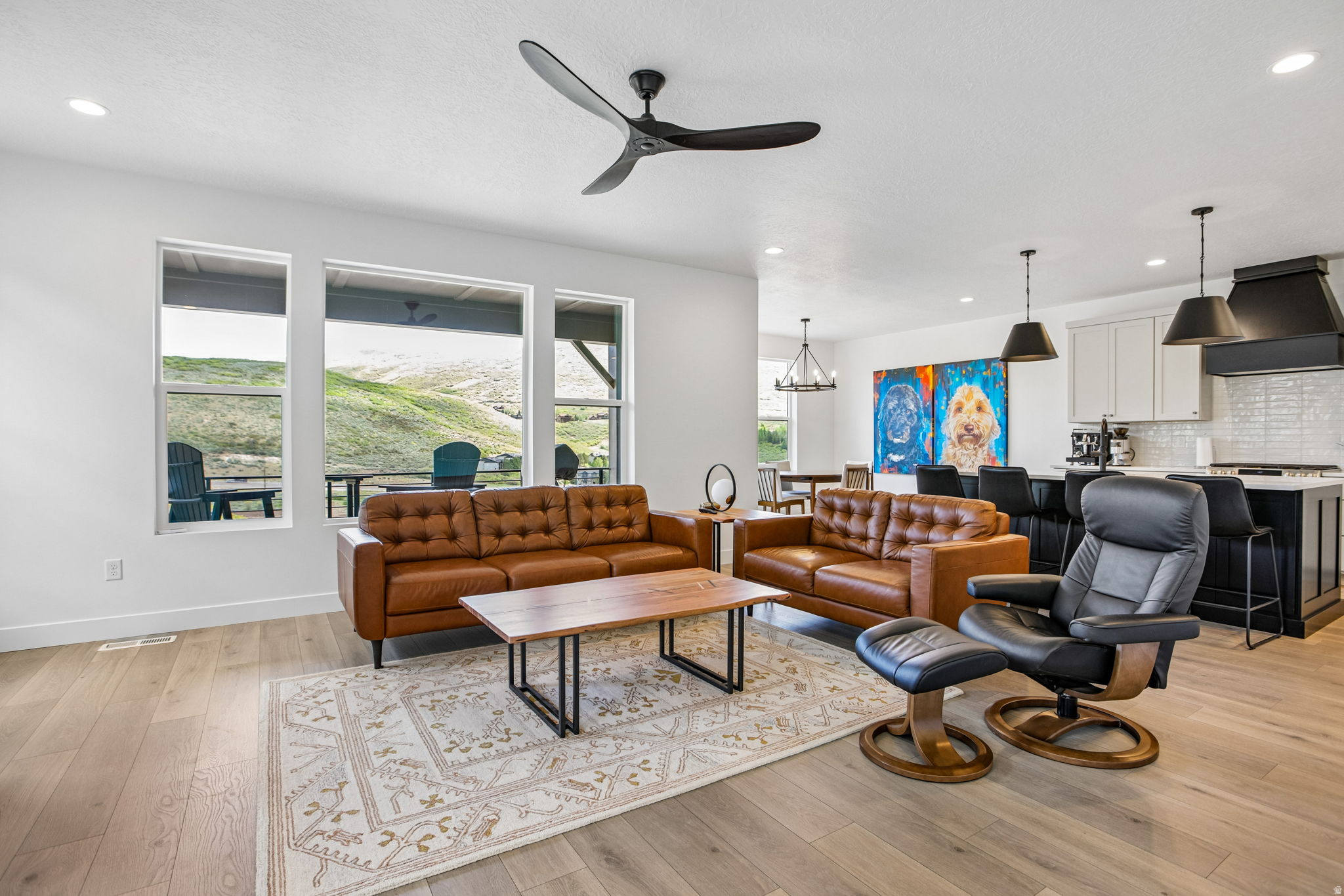 **End Unit | Premium Lot | Unobstructed Valley Views | Move-In Ready** Welcome to your downhill retreat at the Jordanelle! This exceptional end-unit townhome is ideally positioned on a premium $100K lot, offering unobstructed panoramic valley views and the perfect blend of luxury, comfort, and mountain lifestyle-available now for immediate move-in. This charming residence features 4 bedrooms and 3.5 bathrooms, thoughtfully designed to deliver both functionality and elevated living. From the moment you enter, you'll notice the added privacy and natural light that only an end unit can provide, along with expansive windows framing breathtaking scenery. This popular Oakley floor plan features an open-concept layout with expansive windows and large sliding glass doors, creating a seamless connection between indoor and outdoor living. The spacious main living area is anchored by a gas fireplace with custom stone surround, making it ideal for both everyday living and entertaining. At the heart of the home, a chef-caliber kitchen is designed for both style and performance, featuring:  Custom cabinetry with soft-close doors and drawers  Elegant quartz countertops throughout  Designer tile backsplash  Caf stainless steel appliance suite  Oversized island with statement pendant lighting The private primary suite offers a refined retreat with a spa-inspired bathroom, complete with a separate soaking tub and walk-in shower, tile surrounds to the ceiling, and a sleek Euro-glass enclosure, complemented by modern matte black fixtures. The fully finished basement with 9-foot ceilings expands the home's versatility-perfect for a media room, guest space, or recreation area. ________________________________________   Elevated Features & Upgrades  Approximately $120K in premium builder upgrades and design selections  End-unit location with enhanced privacy and light  Expansive, unobstructed valley views  Upgraded flooring and modern interior finishes  Custom metal railing system with matte black accents  Designer lighting package with extensive recessed lighting  Dual-zone HVAC for comfort and efficiency  Google Smart Home  Control and automate connected devices (lights, door locks, cameras, thermostats, to name a few).  Oversize two (2) Car garage professionally installed Ceramic coating. ________________________________________   Unmatched Location & Lifestyle Situated just 5 minutes from the new Deer Valley East Village and only 10 minutes to historic downtown Park City, this home offers unmatched access to world-class amenities while maintaining a peaceful mountain setting. Enjoy year-round recreation with hiking and biking trails woven throughout the community, or spend your days at nearby Jordanelle Reservoir enjoying boating, paddleboarding, and more. Whether you're chasing powder on the slopes, exploring the outdoors, or enjoying Park City's dining and entertainment scene, this location delivers the perfect balance of excitement and tranquility. ________________________________________   A Rare Opportunity With its premium lot, end-unit positioning, unobstructed views, extensive upgrades, and immediate availability, this home stands apart as one of the most desirable offerings in Deer Springs Towns. ________________________________________ Don't miss your opportunity to own a turnkey mountain sanctuary in one of Utah's most sought-after locations.   Square footage figures are provided as a courtesy estimate only and were obtained from public records.  Buyer is advised to obtain an independent measurement.