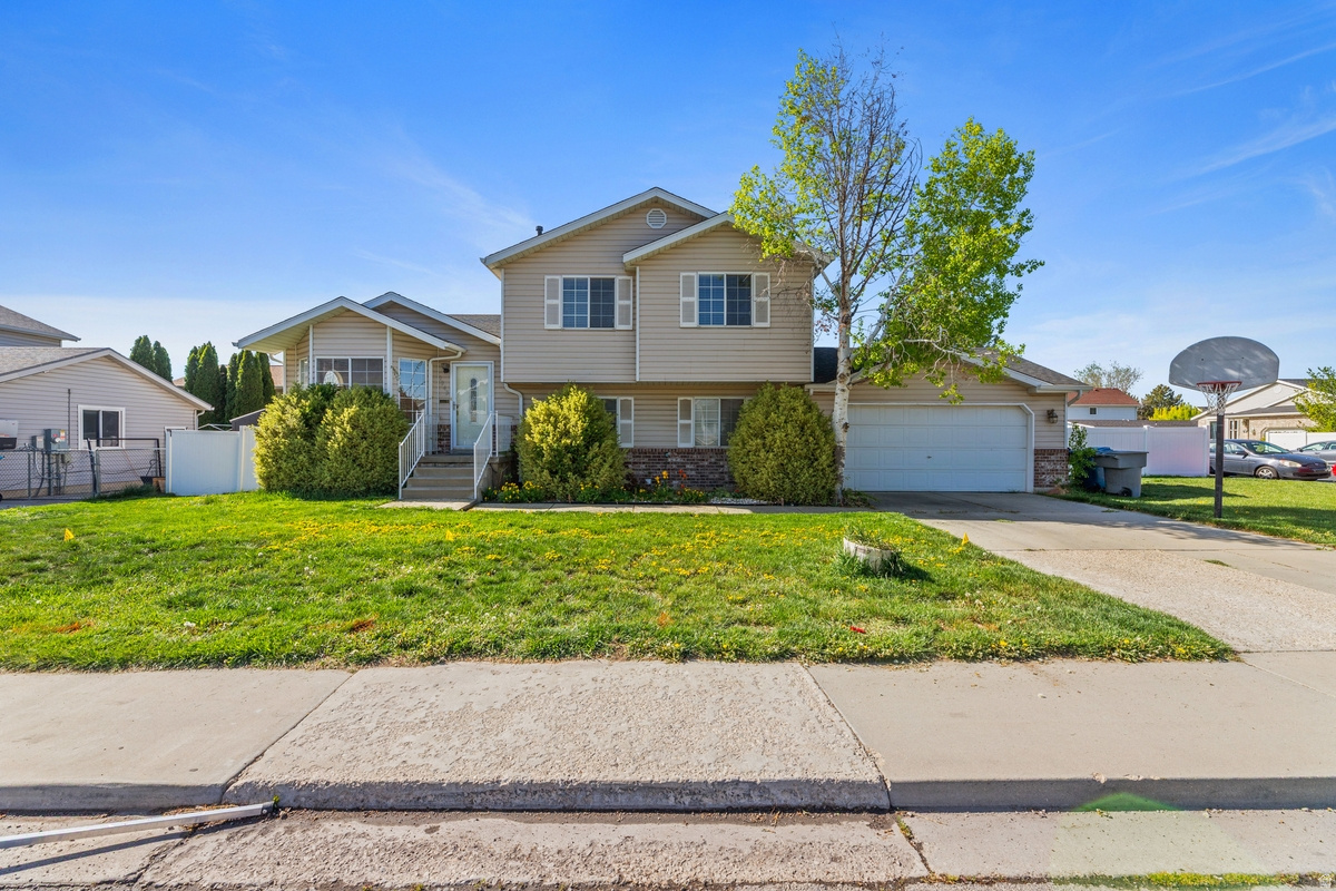 OPEN HOUSE SATURDAY THE 2ND FROM 12pm2pm! Tri-level home in an unbeatable location! Nestled just far enough from Highway 89 to enjoy peace and quiet, yet close enough for quick access to shopping, dining, and daily conveniences, this home truly offers the best of both worlds. Conveniently located just down the street from the elementary school, it's perfectly situated for everyday ease. Inside, you'll find 3 bedrooms, a spacious kitchen and dining area ideal for gathering, and a large family room with plenty of room to relax. A huge mudroom/flex space adds versatility for storage, hobbies, or additional living needs. Outside, the well-maintained backyard is perfect for entertaining or enjoying the outdoors, and the side street access offers potential RV parking. With major updates already completed, including a new water heater, HVAC system, and water softener, this move-in ready home is an excellent opportunity for first-time buyers or anyone looking for comfort, convenience, and a new place to call home. *Square footage figures are provided as a courtesy estimate only and were obtained from the previous MLS listing.  Buyer is advised to obtain an independent measurement.*