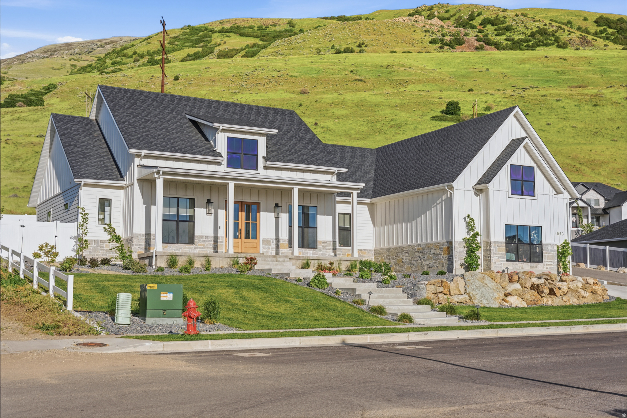 Welcome to this stunning custom-built 2022 home nestled against the mountains of Perry, Utah, with breathtaking views of the surrounding mountains, valley, and Willard Bay. This fully finished 6-bedroom, 4.5-bath home blends luxury, comfort, and outdoor living in one incredible setting.  Inside, you'll find spacious open-concept living, high-end finishes, abundant natural light, and a thoughtfully designed layout built for both everyday living and entertaining. The home features a glass-enclosed piano room, a fully equipped in-home gym with included equipment, and a built-in gun safe with display rack that will remain with the property.  Step outside to a professionally designed backyard retreat featuring a splash pad, in-ground trampoline, covered patio space, and beautifully finished outdoor living areas that take full advantage of the surrounding scenery. Situated on approximately 0.38 acres with a 3-car garage and open space nearby, this property offers a rare combination of privacy, luxury, and stunning views while still being conveniently located near shopping, schools, dining, and I-15 access.  Sellers will review offers Tuesday, May 19 at 6:00 PM MST. Highest and best offers should be submitted prior to the review time. Seller response anticipated by Wednesday, May 20 at 6:00 PM MST. Please submit all offers with current pre-qualification/pre-approval letter or proof of funds to kevin.woods@bhhsutah.com.
