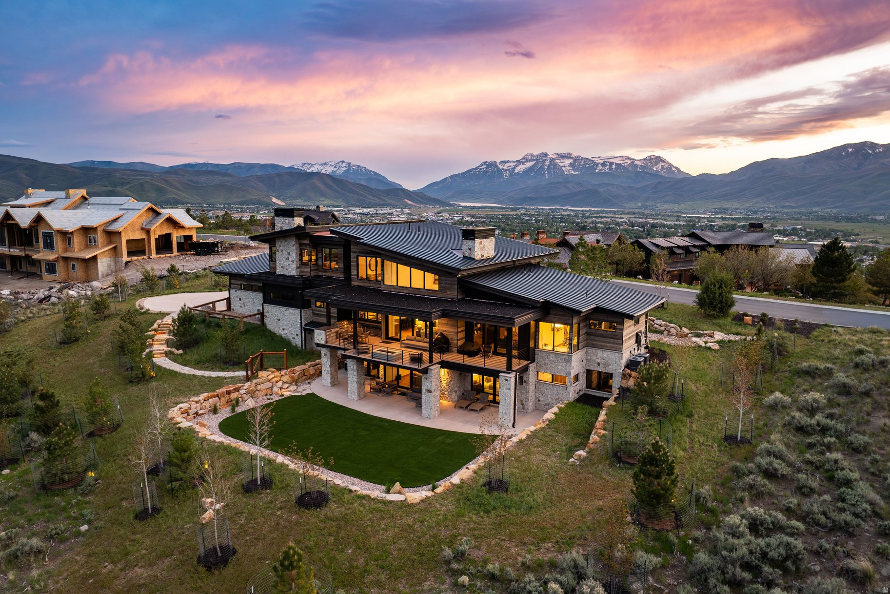Welcome to an exceptional mountain retreat tucked behind the private gates of Red Ledges, where refined luxury meets timeless alpine charm. This newer built, stunning 6 bedroom, 8 bathroom residence is thoughtfully designed, and showcases an open-concept floor plan with elevated finishes and expansive living spaces ideal for entertaining family and guests. Perfectly positioned on a rare double lot, the property offers enhanced privacy and room to breathe, an uncommon find within the community. Extensive landscaping work was completed by the current owners, including rock walls, trees, and a beautiful yard for play with the afternoon shade. Take in sweeping, unobstructed views of Mount Timpanogos and the entire Heber Valley from multiple vantage points, creating a truly breathtaking backdrop year-round. Offering a full golf membership, residents enjoy access to the award-winning Jack Nicklaus Signature Golf Course at Red Ledges, a premier 18-hole championship course renowned for its dramatic elevation changes, red rock cliffs, and sweeping Wasatch Mountain views. Designed to challenge and inspire players of all skill levels, this world-class course offers a true private club experience with no two holes alike. Conveniently located just 15 minutes from Deer Valley East Village and 25 minutes from Park City, you'll enjoy effortless access to world-class skiing. A rare opportunity to own a legacy property in one of Utah's most sought-after private communities.
