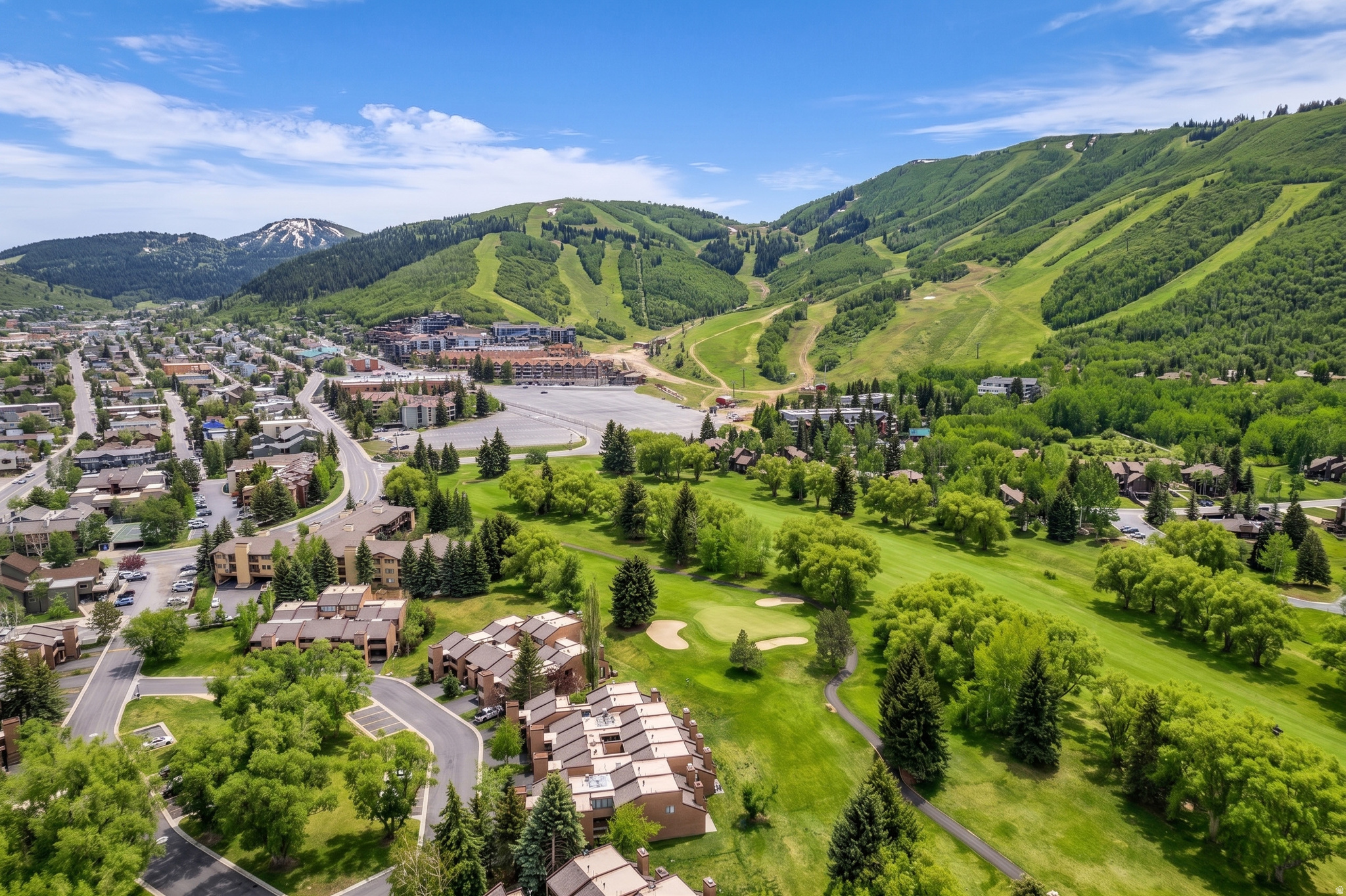 This is your chance to own a rarely available Park Ave Condo backing up to the golf course! This 3-bedroom, 3.5-bathroom residence is offered fully furnished and turnkey, providing a seamless transition for use as a primary home, high-performing investment, or luxury mountain getaway. The heart of the home is a true chef's kitchen, featuring a Sub-Zero refrigerator, professional gas range, and premium finishes that flow into an open living space warmed by radiant floor heat and a cozy fireplace.  The primary suite serves as a private sanctuary, complete with a spa-like bathroom featuring an expanded shower, skylights, and a private balcony for morning coffee with serene, open-space views. This condo has extra flexibility as one of the suites has a separate entrance and can be locked off as a separate rental unit. Enjoy sunset views from the private patio, safe from errant golf balls overlooking the 18th teebox.  The private hot tub is the perfect spot for aprs ski relaxation. Functionality meets convenience with covered parking, extra gear storage, and walkable access to the free city bus, grocery stores, world-class trails, skiing, and the vibrant dining and shopping of Main Street. Backed by strong rental history and great HOA amenities including a pool, hot tubs, sauna, and tennis courts, this property represents a unique opportunity to own a perfectly positioned piece of the  Park City lifestyle