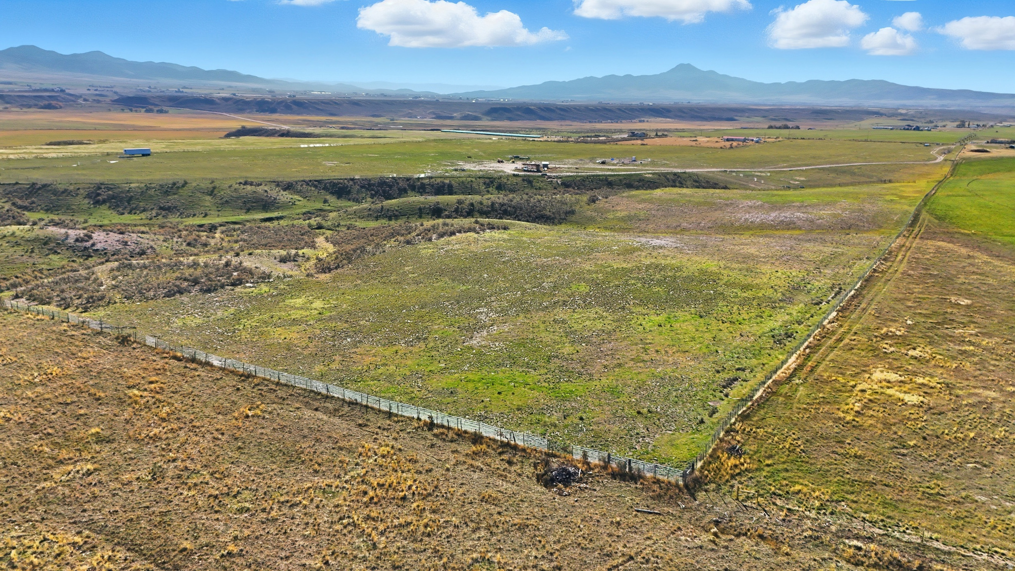 Aww the good life!! Are you ready to have a Homesteaders Farm with 65 acres, 2 septic systems, 3 RV connections, Well installed and 800 amp Electrical service? It's Completely fenced/cross fence on property, Unbelievable Mountain Views, has been used as pasture for cows and goats, recreational property. Seller finance available. 520 feet of hard surface of Hawkins Road, 3 min west of I-15, Wildlife visits, Mule deer, Moose, Pheasants upland game, Cutthroat & rainbow trout fishing at nearby reservoirs. Bring your Livestock or horses and enjoy the rural, open country land.