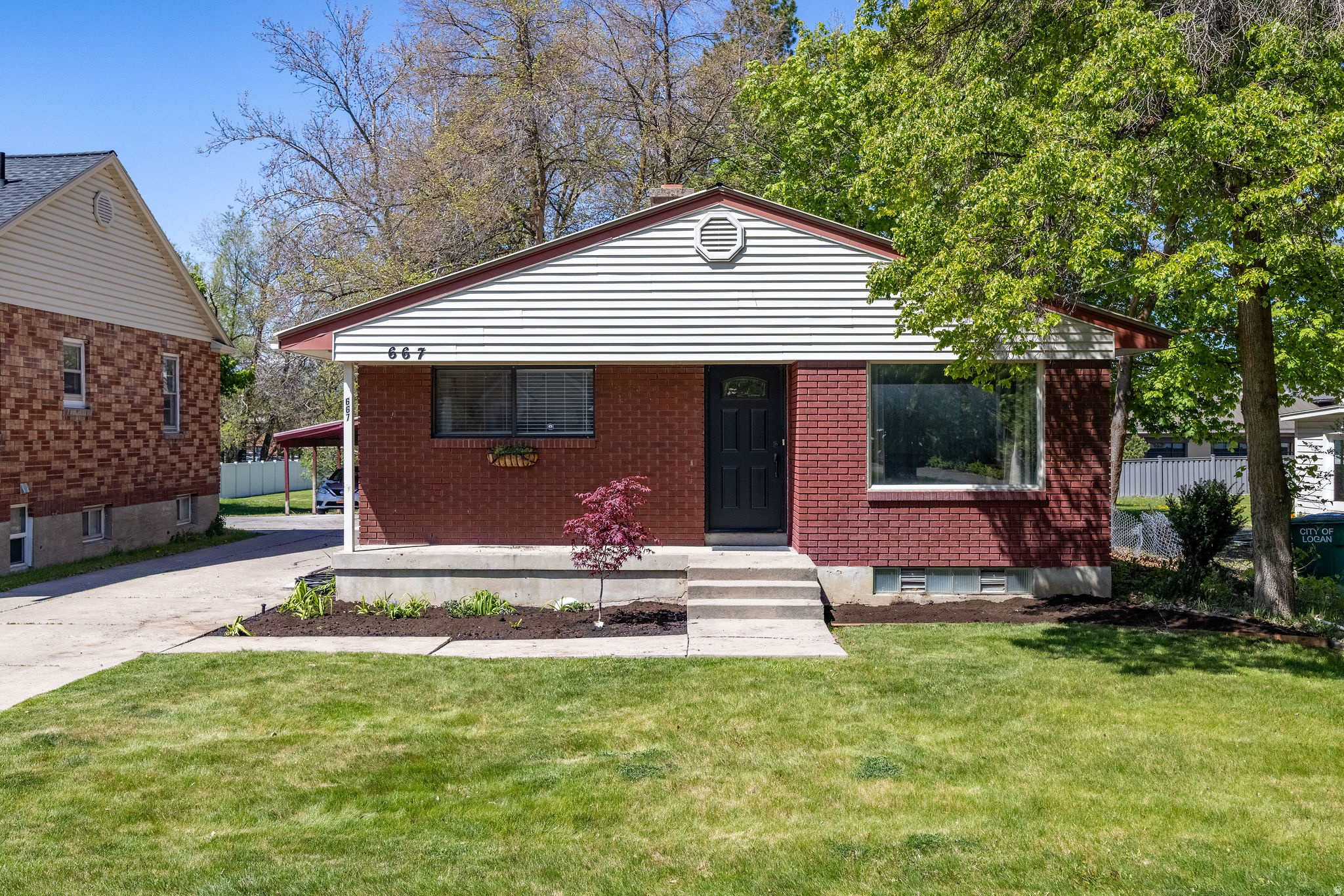 This centrally located DUPLEX features a spacious 4-bdrm, 2-bath main unit, along with a separate 1-bdrm, 1-bath basement apartment. Perfect for rental income or multi-generational living. Large 2-car garage. Situated on a generous .37-acre lot, the fenced backyard offers a sprinkler system, basketball court, and plenty of space for outdoor entertaining and recreation. Centrally located.