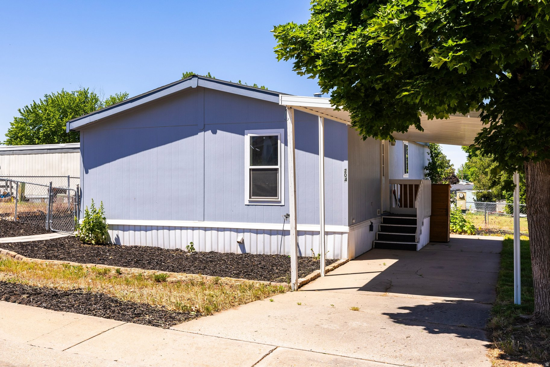 Welcome home to this beautifully renovated residence in the highly desirable Quail Ridge Manufactured Home Community. Thoughtfully redesigned with modern finishes and everyday comfort in mind, this turnkey property offers a fresh, stylish living experience from the moment you step inside. Ideally located in Layton, you'll enjoy convenient access to shopping, dining, parks, schools, and I-15 while still benefiting from the peaceful atmosphere of this welcoming community. Whether you're a first-time buyer, downsizing, or simply looking for a move-in-ready home, this one checks all the boxes. Schedule your private tour today.