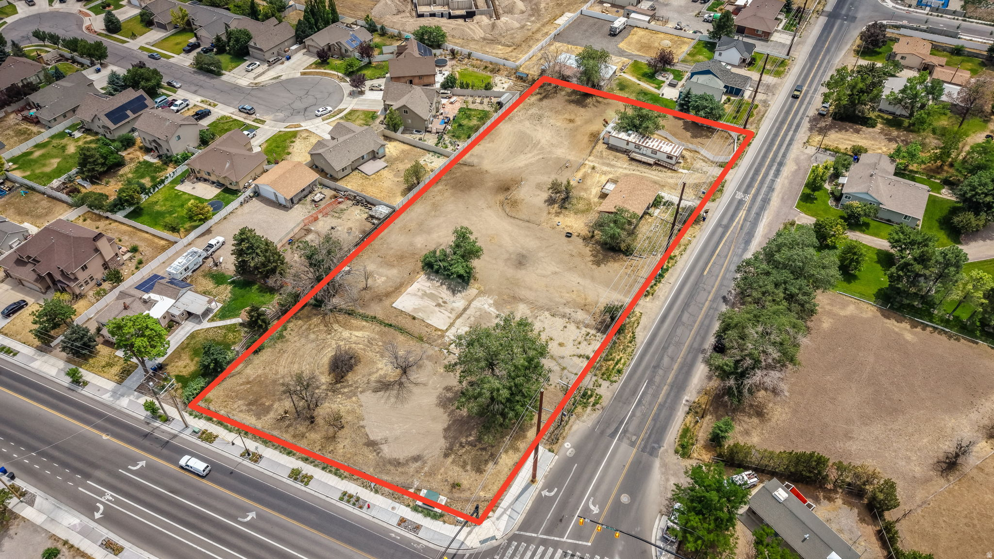 PRIME COMMERCIAL LOCATION! Fantastic opportunity to build on one of the last corner lots available in Herriman, in a rapidly growing area. High traffic count with visibility & accessibility. Future developments are expected to boost the traffic count immensely. Flat lot for building. Zoned C-2 with a wide range of possibilities. Permitted uses include but are not limited to: Convenience Store/Gas Station, Animal Care, Banks & Financial Institutions, Professional Office, Medical/Dental Services, Day Care, Professional Services, and General Retail. MLS#2172521 Tax ID 26-35-302-039 also listed, to be included in the sale. List price of $1,650,000 includes BOTH properties.
