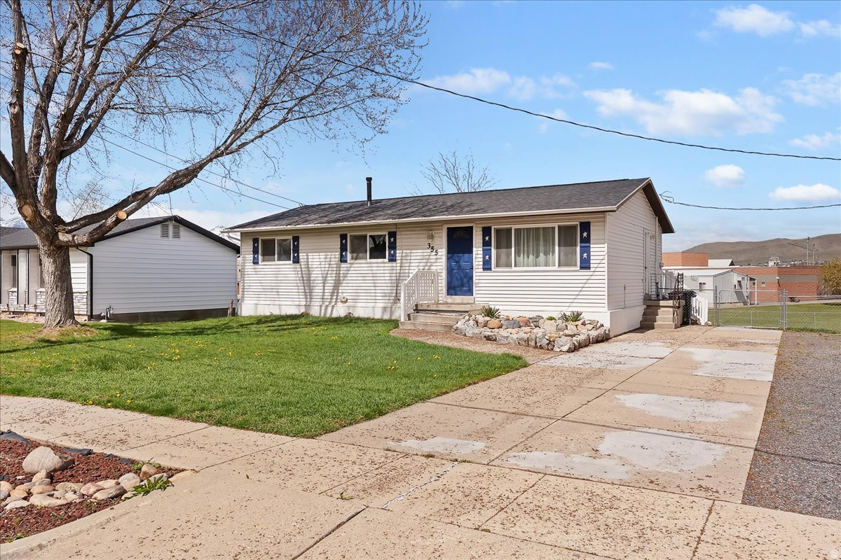 Priced right in the heart of Morgan-with a recent price improvement, and proven rental income! The spacious 5 bed, 1 full + 2 1 bath home featuring two kitchens and ADU potential-perfect for multi-gen living or added income. Bright, functional layout with room to grow. Step outside to a large deck where you can watch local festivities and fireworks right from home. Ideally located next to the elementary school in a quiet, established neighborhood with easy access to town and commuting routes. Rare opportunity with flexibility and value-don't miss it!  Square footage figures are provided as a courtesy estimate only and were obtained from county .  Buyer is advised to obtain an independent measurement. Note the range in the ADU kitchen is electric.