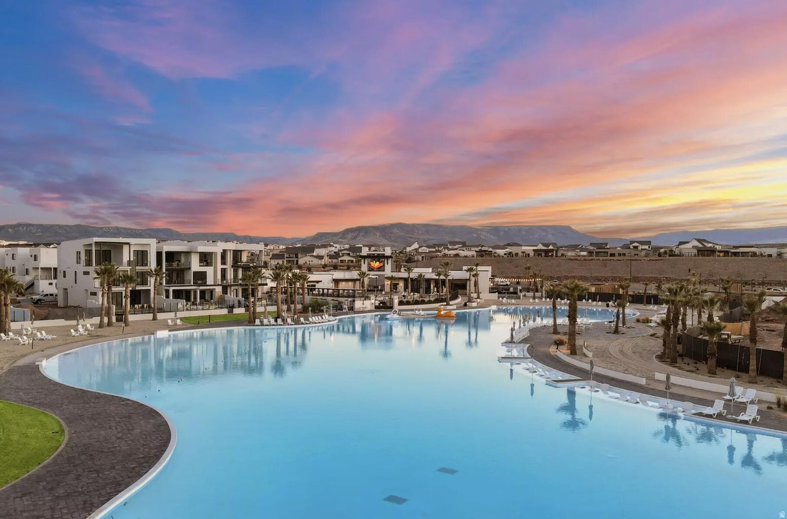 Experience the best of the Desert Color community in this beautifully maintained third-floor condo featuring breathtaking views of St. George's iconic red rock landscape. The open-concept floor plan is filled with natural light and offers a stylish kitchen with updated appliances, a spacious primary suite with a private ensuite bathroom and walk-in closet, and a covered balcony where you can relax and take in the stunning scenery. Residents enjoy exceptional resort-style amenities including a 2.5-acre lagoon for paddleboarding and kayaking, multiple parks, pickleball courts, two additional swimming pools, and relaxing hot tubs. Conveniently located just minutes from shopping, restaurants, outdoor recreation, and Costco, this home offers an outstanding combination of comfort, convenience, and the Southern Utah lifestyle.