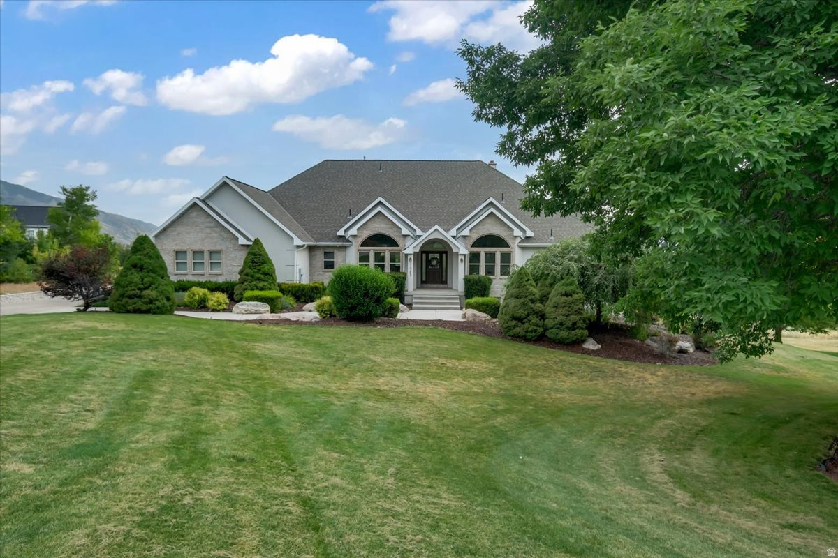 Situated on just over an acre, this one-of-a-kind property offers truly breathtaking, 10/10 panoramic views that are hard to find. Designed for both everyday living and entertaining, the home features expansive outdoor space with a massive back deck perfect for hosting family and friends. Take in the incredible scenery and amazing wildlife.  Inside, you'll find a beautifully remodeled kitchen showcasing a stunning Monogram gas range with double ovens, a custom wood vent hood, honed marble and granite counters and a convenient walk-through butler's pantry. Cozy up by the wood-burning or gas fireplace on both the main and lower levels, enjoy year-round comfort with dual climate controls for upstairs and downstairs, and love the brand-new carpet throughout the upper level. With unmatched views, exceptional land, and thoughtful high-end upgrades, this is a rare opportunity to own a property unlike any other. Owner Agent -   Square footage figures are provided as a courtesy estimate only and were obtained from appraisal .  Buyer is advised to obtain an independent measurement.