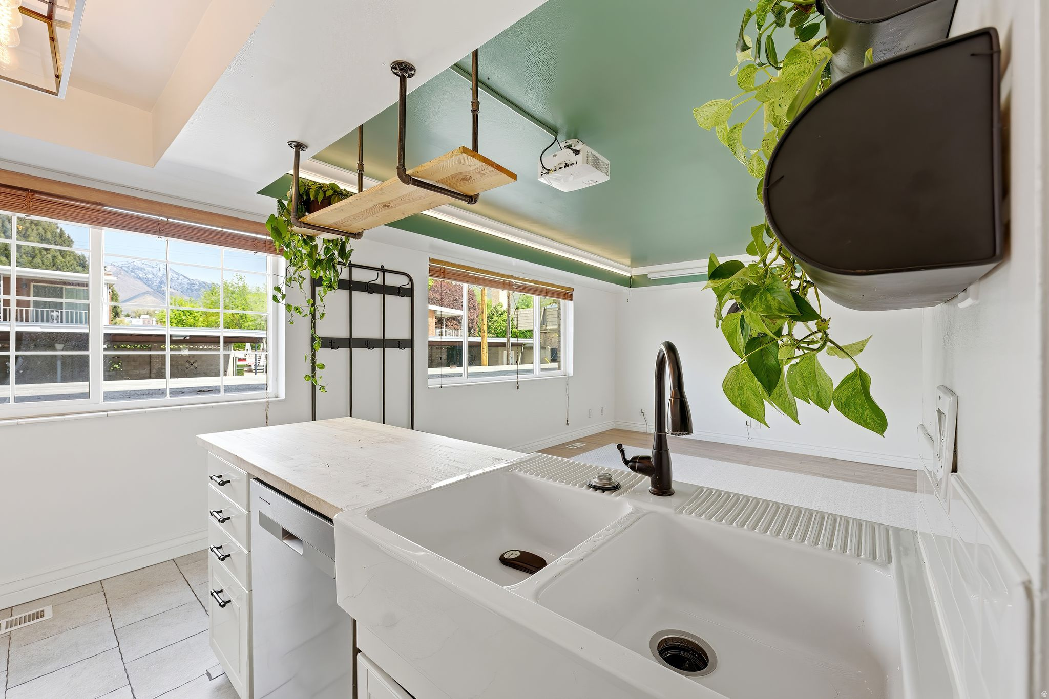 Seller offering 1/0 rate buydown with preferred lender 5.43% first-year rate available. Contact agent for details. Welcome to Holladay living at its best! This beautifully updated condo is filled with natural light and fresh, modern finishes throughout. Recent updates include new appliances (all included), fresh paint, new carpet, and updated windows. Making this a truly move-in-ready opportunity. The mountain views to the east frame the livingroom and kitchen windows, bringing in both light and a sense of calm. The living space is thoughtfully upgraded with a "professional home cinema" setup, featuring in-wall surround sound wiring and smart lighting in the living room, creating the perfect environment to relax or entertain. Located just a short walk from Holladay City Center, you'll love having Harmons, local coffee shops, fitness studios, and some of the area's best dining right outside your door. It's the kind of location that makes everyday living feel effortless. Aix La Chapelle is a well-maintained, owner-occupied community featuring two pools, a sauna, a fitness room, covered parking, additional storage, and designated pet areas. The HOA covers most utilities, with only power and internet paid separately. Whether you're looking for a low-maintenance primary residence or a beautifully updated space in one of Holladay's most walkable neighborhoods, this is a rare opportunity to own in a highly desirable community