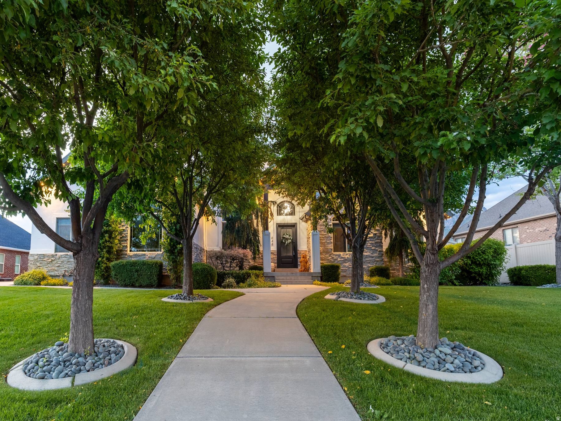 Welcome to this spacious luxury home in the desirable Gillman subdivision in Lindon. Situated on a generous half acre lot with mature trees, this impressive property was built in 2005 and remodeled with high end finishes, and the roof was replaced in 2025. The thoughtfully designed floor plan includes multiple living spaces, offering flexibility for home offices, guest suites, or hobby rooms. Step outside to enjoy the gorgeous backyard, featuring a swimming pool-perfect for summer gatherings, relaxing weekends, and outdoor entertaining. The spacious yard provides plenty of additional room for play, gardening, or your customization. Brand new Permanent Holiday Lighting installed in 2025. Located in a quiet residential neighborhood with NO HOA, the home offers privacy while still being close to shopping, dining, parks, and major commuting routes throughout Utah County.  Square footage figures are provided as a courtesy estimate only and were obtained from ______________ .  Buyer is advised to obtain an independent measurement.