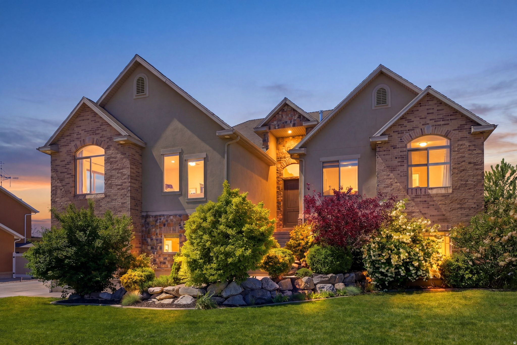 Welcome to 223 N Ranch Rd in Farmington Ranches - a light-filled 6-bedroom, 5.5-bath home offering 4,676 sq ft, mountain and sunset views, a walkout daylight basement, generous RV parking, and a fully fenced flat backyard with fruit trees. Priced at $1,149,900, this home delivers space, views, and move-in-ready livability in one of Farmington's most convenient neighborhoods near Station Park, top-rated schools, and a quick 25-minute commute to downtown Salt Lake City or the airport.  The home features a spacious kitchen with white cabinets, stainless steel appliances and quartz counter tops.   A great room off of the kitchen with a fireplace and vaulted ceilings.   A covered deck is located just off of the kitchen with views out to the west. A primary suite that is large enough for a king sized bed, a primary bathroom with a double vanity, separate shower and jetted tub and a walk-in closet.    There is an additional more casual family room on the main floor that is perfect for large gatherings.   There are four additional bedrooms and two more bathrooms on this main floor. Downstairs you will enjoy the light and open feeling that the daylight and walkout basement provide.   No window wells in this home.  Everything is above grade.   A wet bar with a cook top is connected to the family room along with a lot of extra space for game tables etc.  Surround sound and built in speakers are all ready for your entertaining.  One bedroom with an on-suite down in the basement.   Tankless water heater, epoxy floors in the garage, generous RV Parking space for any toys that you may have, a flat backyard that is fully fenced a number of fruit trees.