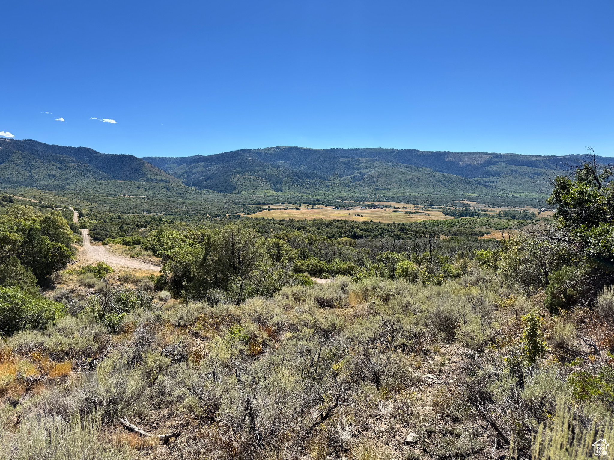 Charming 5-Acre Lot with Stunning Views  Imagine waking up to breathtaking valley views and the peace of nature right outside your door. This beautiful lot offers the perfect setting for your dream home, vacation retreat, or weekend escape. With road access from both the top and bottom, you'll enjoy convenience and flexibility. Just one hour from Lehi, this 5-acre property is full of charm and endless potential-ready for you to make memories.   Driving Directions - take a left when the pavement ends on Meadow view drive, take the next right on Southridge Rd, turn left onto Storm Mountain Dr, take next left onto Mountain Hollow Dr, start up hill and take a left onto Storm Mountain Drive. You will begin descending the hill and you will follow right to Valley View Drive or You can access the property from going straight on Mountain View Road until you you take a left of paradise road. You can can access property from both Valley View from the top or It maybe better to access from the bottom of the property of off Paradise Road. *** DO NOT GO UP Black Hawk Mount Estates Road ***