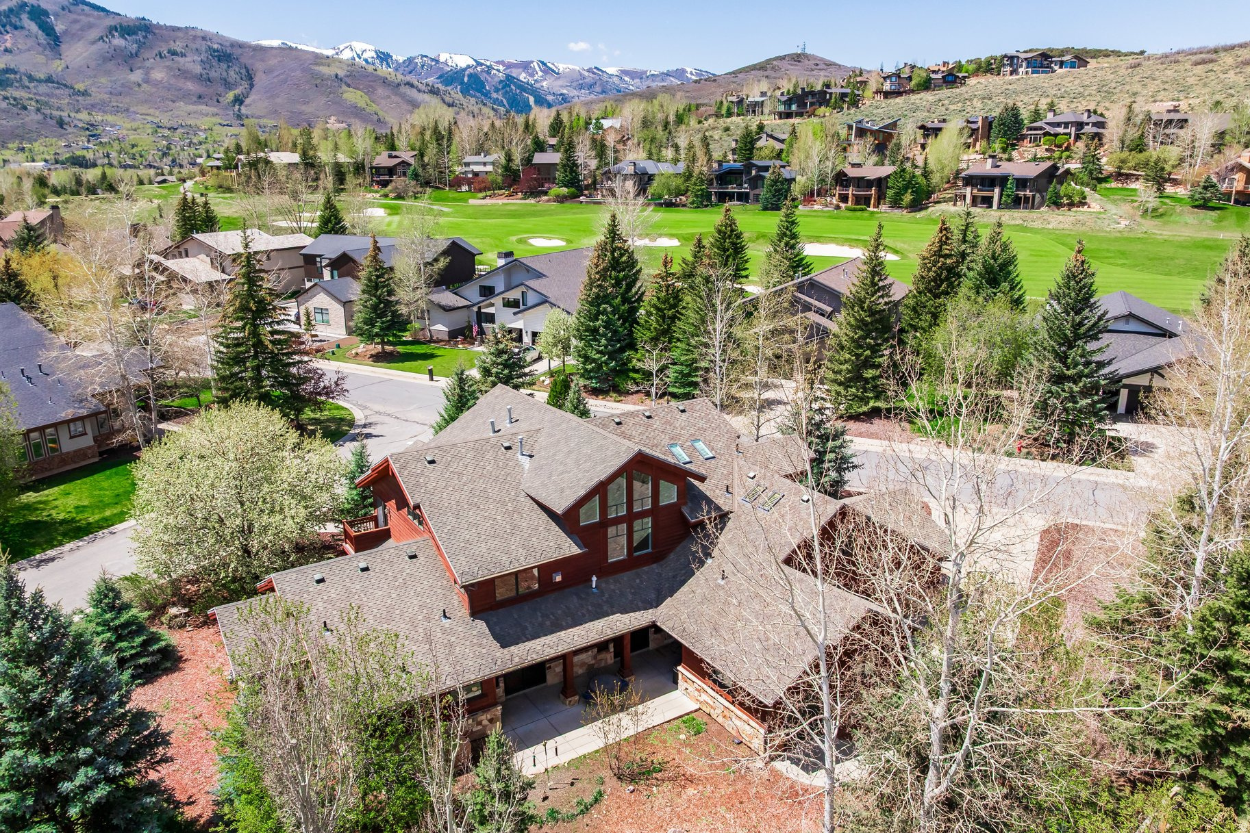 Nestled on a peaceful cul-de-sac in coveted Park Meadows, this beautifully crafted 4-bedroom home blends timeless quality with mountain elegance. Spanning over 4700 square feet, the residence showcases rich wood floors with intricate Wisconsin inlay, a testament to its exceptional craftsmanship. Architecturally designed by Kevin Scholz. The main-level primary suite offers comfort and privacy, while a library and two dedicated offices provide flexible spaces for work and reflection. Designed with both family living and entertaining in mind, the home opens to tranquil mountain views that capture the essence of Park City living. A rare opportunity to own a solidly built, thoughtfully designed retreat in one of the area's most desirable neighborhoods.