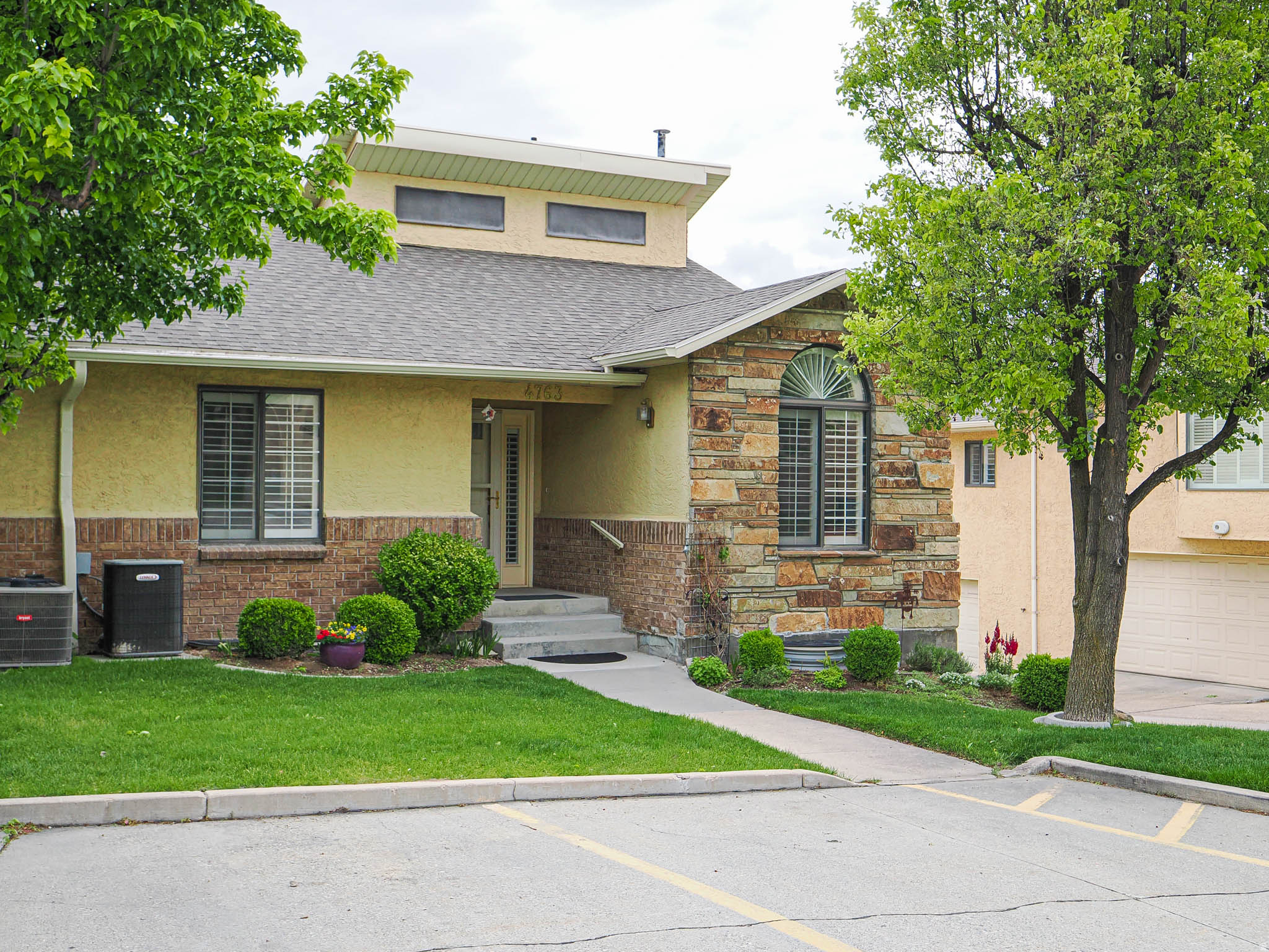 Beautiful town home in Millcreek  / Very Well Maintained / End Unit with lot of Windows and Natural Light / Very nice Views of the East Mountains / Great room with Fireplace and Vaulted Ceilings / Plantation Shutters / Great Storage / Large 2 Car Garage