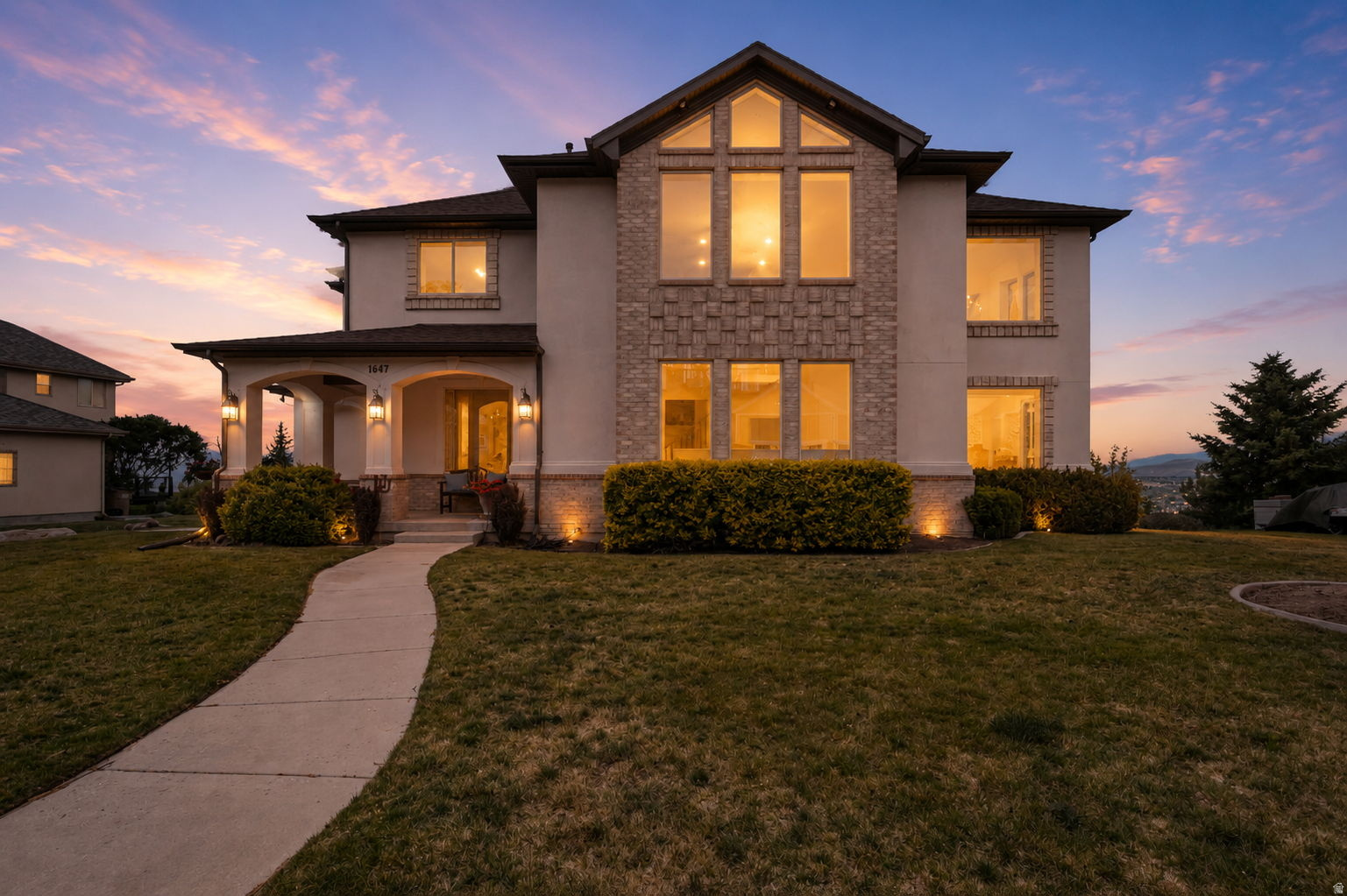 Beautifully updated with a major 2026 remodel, this Draper home brings big views, bold design, and dramatic spaces that make it feel anything but ordinary. From the two-story entry and soaring great room to the massive kitchen island and sweeping valley views, this home was made to impress. The main floor features brand-new LVP flooring, fresh paint, new baseboards, Taj Mahal countertops with waterfall edge, heated LVP in the kitchen, an appliance garage, and modern custom finishes. Additional updates continue upstairs, including new LVP on the landing and in the primary bedroom, along with refreshed bathroom spaces and thoughtful design details. The exterior was refreshed in 2021 with updated stucco paint, high-contrast trim, and wood-look garage and front door, followed by a new roof in 2022. Windows throughout the home showcase views toward Antelope Island, the Oquirrh Mountains, Corner Canyon, and unforgettable sunsets. Add in a spacious primary suite, multiple gathering spaces, a 3-car garage, RV parking, and a highly desirable south Draper location, and this one checks the boxes for style, space, and location. Square footage figures are provided as a courtesy estimate only. Buyer/Broker is advised to verify all. Owner/Agent.
