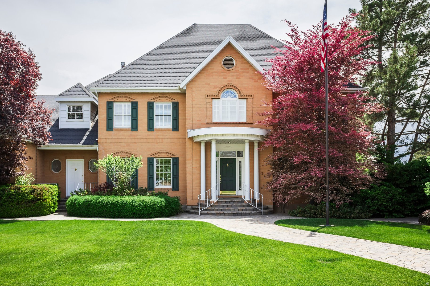 The all-brick exterior and quiet cul-de-sac location give this home incredible curb appeal from the moment you arrive. Beautiful paver work in both the front and back yards adds to the charm and creates inviting outdoor spaces to enjoy year-round. The recently updated backyard is made for relaxing and entertaining, featuring a hot tub, built-in fire pit, spacious patios, and custom planters. Inside, you'll find rich cherry wood cabinetry, detailed finish carpentry, and built-in bookshelves throughout the home that add warmth and character. The 9-foot ceilings on the main and upper levels make the home feel bright, open, and spacious. The kitchen and family room flow together perfectly and provide plenty of space for family gatherings or entertaining guests. The main floor also includes a large office/den, formal dining room, and formal living room. Downstairs offers a unique indoor sport court with a golf driving range that could easily be used for a variety of activities. You'll also find a large game/family room along with a guest bedroom and bathroom. Upstairs features wide hallways, five spacious bedrooms, and three bathrooms. There's also an abundance of storage throughout the home. Located in the highly desirable Stonewood neighborhood, this home is conveniently close to shopping, dining, freeway access, BYU, and UVU.