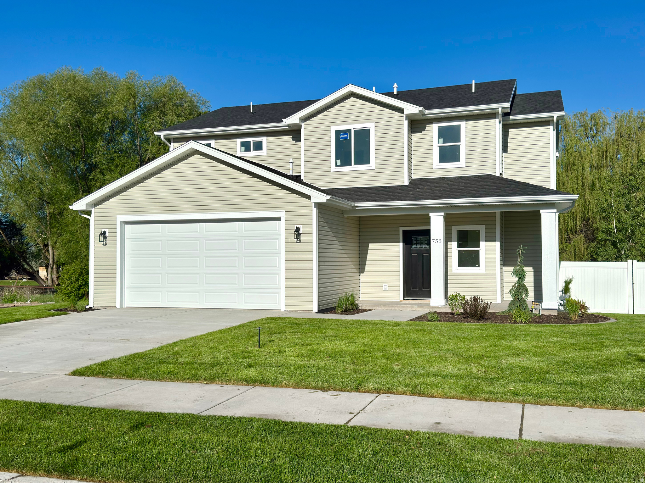 Beautiful new construction home located in the new Robson Ranch subdivision. This home features a bright open-concept layout with modern finishes throughout. The spacious two-story design offers a large living area with expansive windows that bring in tons of natural light, a sleek electric fireplace, and durable wood-style laminate flooring. The kitchen is designed with both style and function in mind, featuring custom cabinetry, quartz countertops, a large center island, stainless steel appliances, modern lighting, and a spacious pantry. The main level includes a convenient half bath and welcoming entry space, while upstairs offers four comfortable bedrooms with thoughtfully designed layouts. The primary suite features a large walk-in closet along with a spacious bathroom complete with a walk-in shower and relaxing soaker tub. Outside, enjoy a fully landscaped and fully fenced front and backyard with automatic sprinkler systems, finished flower beds with auto-drip systems, a deck, large driveway, and attached 2-car garage. This home is move-in ready and offers a great combination of comfort, style, and functionality.  Square footage figures are provided as a courtesy estimate only and were obtained from house plans.  Buyer is advised to obtain an independent measurement.