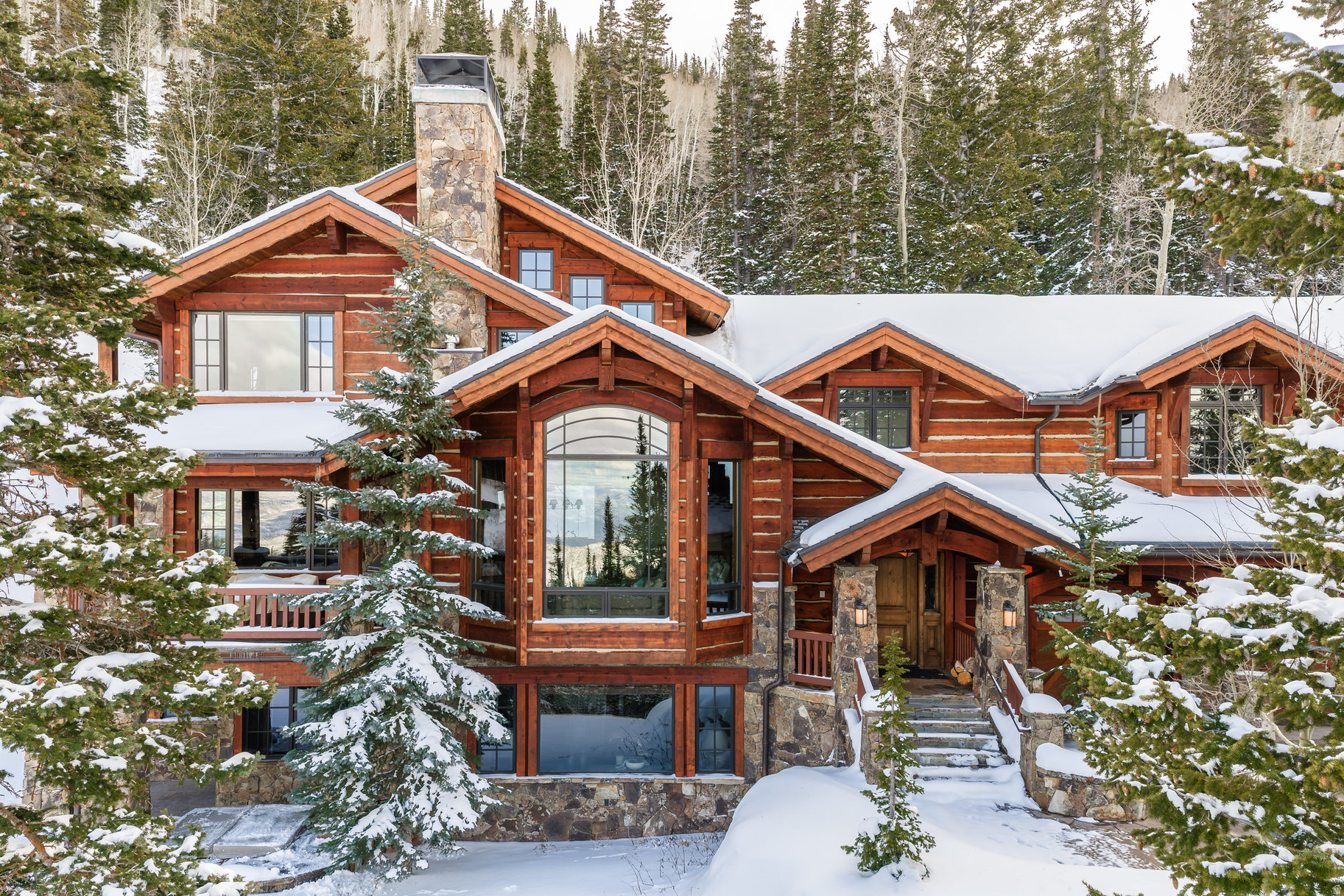 125 White Pine Canyon Road sits at the heart of The Colony at White Pine Canyon, Park City's premier private ski-in/ski-out community. Positioned off the Panorama ski run at Park City Mountain Resort, this remarkable property offers unmatched seclusion with over 10 acres, sweeping views, and pine-filled valleys merging into world-class ski terrain.  From arrival, a welcoming driveway and private ski bridge set the tone for a serene mountain escape. Designed by Otto-Walker and brought to life by Andrew Parker, the Dream Catcher Lodge blends timeless mountain elegance with the warmth of a family legacy estate. SLC International Airport is only 45 minutes away, making travel effortless.   This sanctuary of mountain luxury features a tranquil master suite, a thoughtfully arranged second-level bedroom wing, and a convenient guest suite on the lower level for privacy. The inviting mountain aesthetic creates a space for unforgettable gatherings and cherished memories.  Experience ultimate convenience with a custom ski prep room just steps from the ski run, complete with a steam room to recharge for every adventure. After a thrilling day, unwind in the hot tub overlooking breathtaking mountain vistas.   Canyons Village is only 10 minutes away, with Park City's lively Historic Main Street and Kimball Junction amenities within easy reach. Whether carving fresh tracks or enjoying local attractions, this location puts the best of Park City at your fingertips.   The Dream Catcher Lodge isn't just a home, it's a lifestyle of luxury, privacy, and access to the American West's most spectacular scenery. Schedule a private tour and discover your next family legacy estate today!