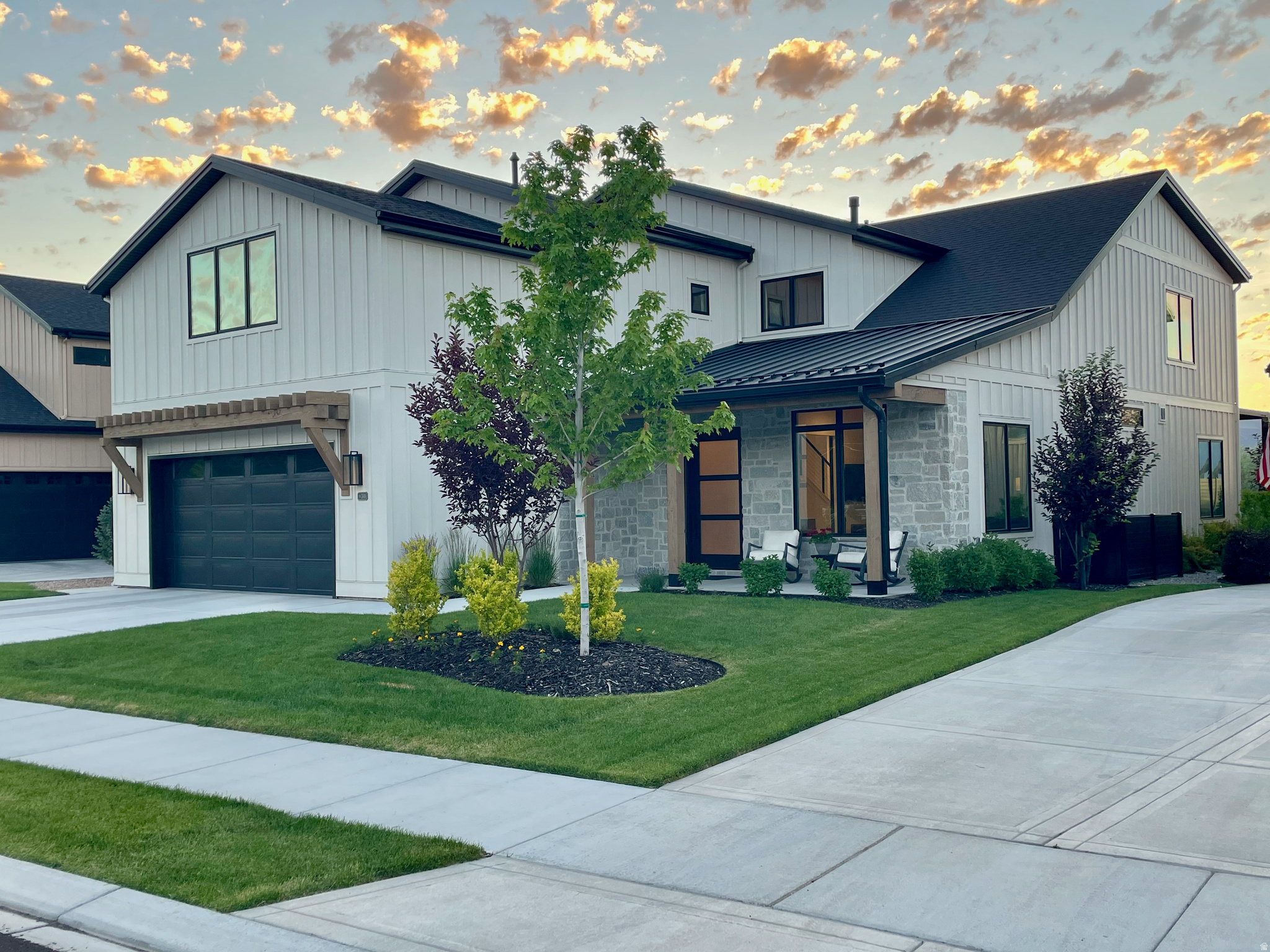 Thoughtfully upgraded and impeccably maintained, this exceptional residence offers protected open space views with a finish level of quality and customization that is rare to find. From the moment you enter, you'll appreciate the stunning stone entryway and floor-to-ceiling stone fireplace that creates a warm yet sophisticated first impression. The open-concept floor plan is filled with natural light and designed for effortless entertaining. At the heart of the home is a daylight chef's kitchen featuring a 48" range, double ovens, quartz countertops, large eat-in island, beverage center, and a spacious walk-in pantry. The dining and family rooms flow seamlessly together, creating inviting spaces for both everyday living and hosting guests. The luxurious main-level owner's suite offers a spa-inspired ensuite bath with dual vanities, a large walk-in shower, enclosed commode, and generous walk-in closet. Continue to the mud/laundry with side-by-side washer/dryer and custom lockers. A thoughtfully designed office with built-in cabinetry and accent wall complete the main level. Upstairs, soaring 9-foot ceilings create a sense of openness for the secondary family room that serves as the perfect theater. Complemented by a stylish wet bar kitchenette, making it ideal for entertaining. 4 spacious spacious guest rooms and 3 full bathrooms round out the second level. Designed with comfort and convenience in mind, additional features include automated lighting, ceiling fans, whole-house water filtration system, whole-house fan, and motorized shades throughout all bedrooms and patio areas. The oversized garage features professionally coated flooring and 240V infrastructure for electric vehicle charging. Outside, enjoy the custom stone fire pit and take in the stunning views of Memorial Hill and miles of protected open space. Ideally located just minutes from world-renowned ski resorts, golf courses, reservoirs, outdoor trails, and historic Midway Main Street.