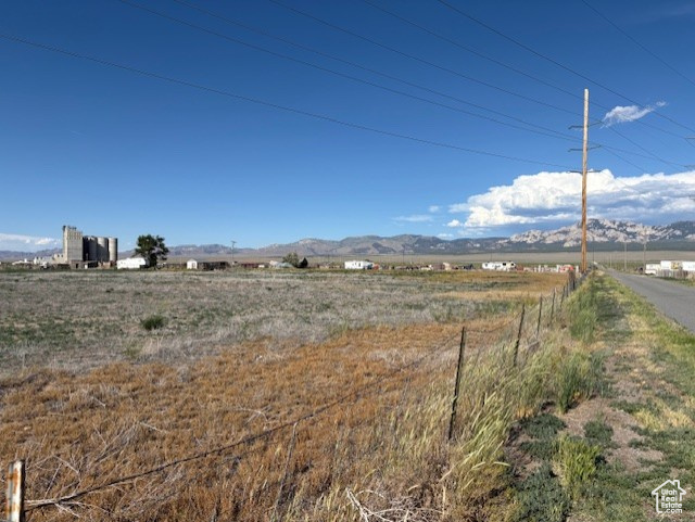 Discover the perfect blend of comfort and convenience with this exceptional property! Located just minutes from city utilities, this flat, fully fenced lot boasts expansive grass areas, ideal for outdoor activities and gatherings.  Imagine waking up to breathtaking scenic views every day! This prime piece of real estate offers a fantastic opportunity for anyone looking to build their dream home in a sought-after area. Don't miss your chance to own this slice of paradise-schedule a showing today!