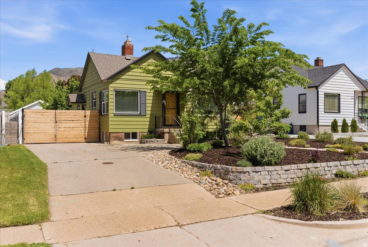 Welcome to this charming East Bench gem where location and lifestyle come together perfectly! Just minutes from hiking, biking, rock climbing, parks, and schools, this home offers the best of outdoor living with all the warmth and character you'd expect from the East Bench. Inside, you'll love the updated kitchen, beautiful hardwood floors, exposed brick accents, and inviting spaces full of timeless charm. The lower level features a spacious family room, additional bedroom, 3/4 bath, laundry, storage, and a versatile den or office space. Step outside to the true showstopper - an incredible outdoor living area complete with a covered patio, open yard, and separate garden space perfect for relaxing or entertaining. Add in a true 2-car garage and RV parking, and this home checks all the boxes!