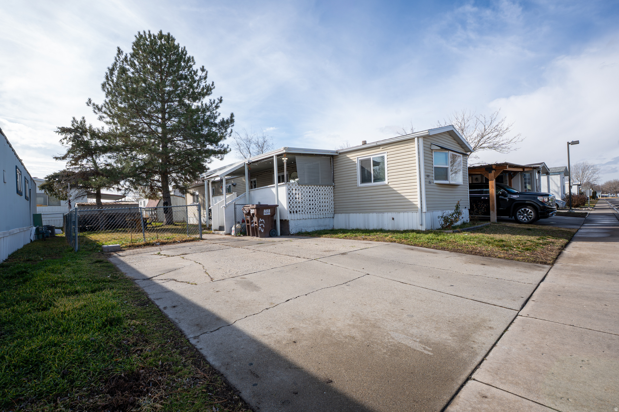 Welcome to this beautiful mobile home located in West Valley! The main living area is bright and comfortable, featuring updated flooring and large front-facing windows that bring in great natural light. The home also includes new windows installed in 2024, a new A/C system in 2024, and a roof replaced in 2023, providing peace of mind for years to come. The layout flows directly into the kitchen, where there's space for a full dining table - not just a small breakfast nook - making it functional for everyday living and gatherings. Down the hall are three bedrooms, offering flexibility for a home office, guest room, or kids' rooms. Step outside to the covered patio, which creates an inviting outdoor retreat, perfect for relaxing or hosting. Convenient access to Bangerter Highway, shopping, and local amenities makes this a practical option for affordable ownership in the Salt Lake Valley. Book your showing today!