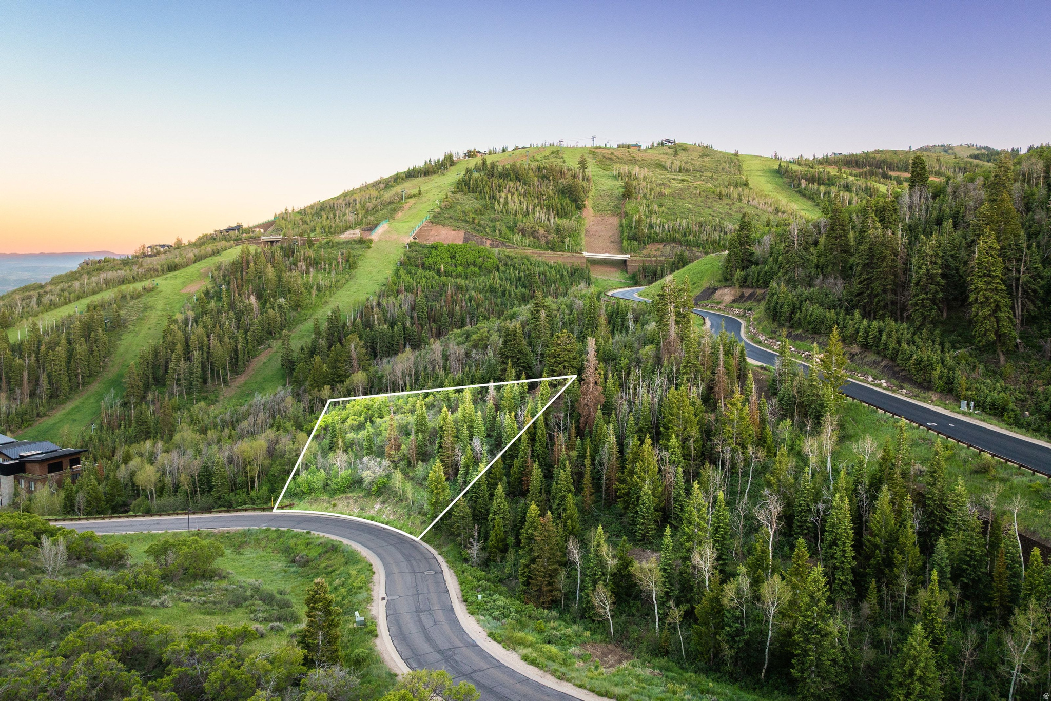 Deer Crest does not offer second chances. This is one of the few buildable homesites remaining inside the private gates of one of Deer Valley's most coveted and centrally located neighborhoods. A gently down sloping 1.4 acre estate homesite opens to sweeping views of Deer Valley's legendary ski terrain to the south and the ancient Uinta National Forest to the east, framed by a rare canopy of mature aspens and pines that took generations to grow and cannot be manufactured. Ski accessibility for owners is thru off-piste terrain from the Deer Hollow Ski run directly to the property.   The St. Regis Deer Valley -- its restaurants, spa, and aprs scene -- is a short walk away. Historic Old Town Park City is just over a mile, accessible through the neighborhood's private gates. And Deer Valley's transformative East Village, already reshaping the mountain's future, is within easy reach through the Eastgate.   What makes Deer Crest genuinely rare is its position in the market. It is not simply a neighborhood -- it is now the geographic center of the entire Park City-Deer Valley experience. Through one gate you reach the energy of Historic Main Street. Through another, the new East Village dining and retail district taking shape at Deer Valley's expanding base. The St. Regis anchors the location. The mountain is at your ski tips. Very few addresses in Utah sit this precisely at the intersection of world-class skiing, authentic mountain town culture, and ultra-luxury resort infrastructure.  That positioning will compound with the 2034 Winter Olympics coming to Utah, and Deer Valley -- an event that historically redefines property demand and places host mountain communities like Deer Valley on a permanent global stage. The window to build in Deer Crest before 2034 is not wide.  Land like this, in a neighborhood this private, is nearly gone. What remains is the opportunity to build something extraordinary while it still exists.